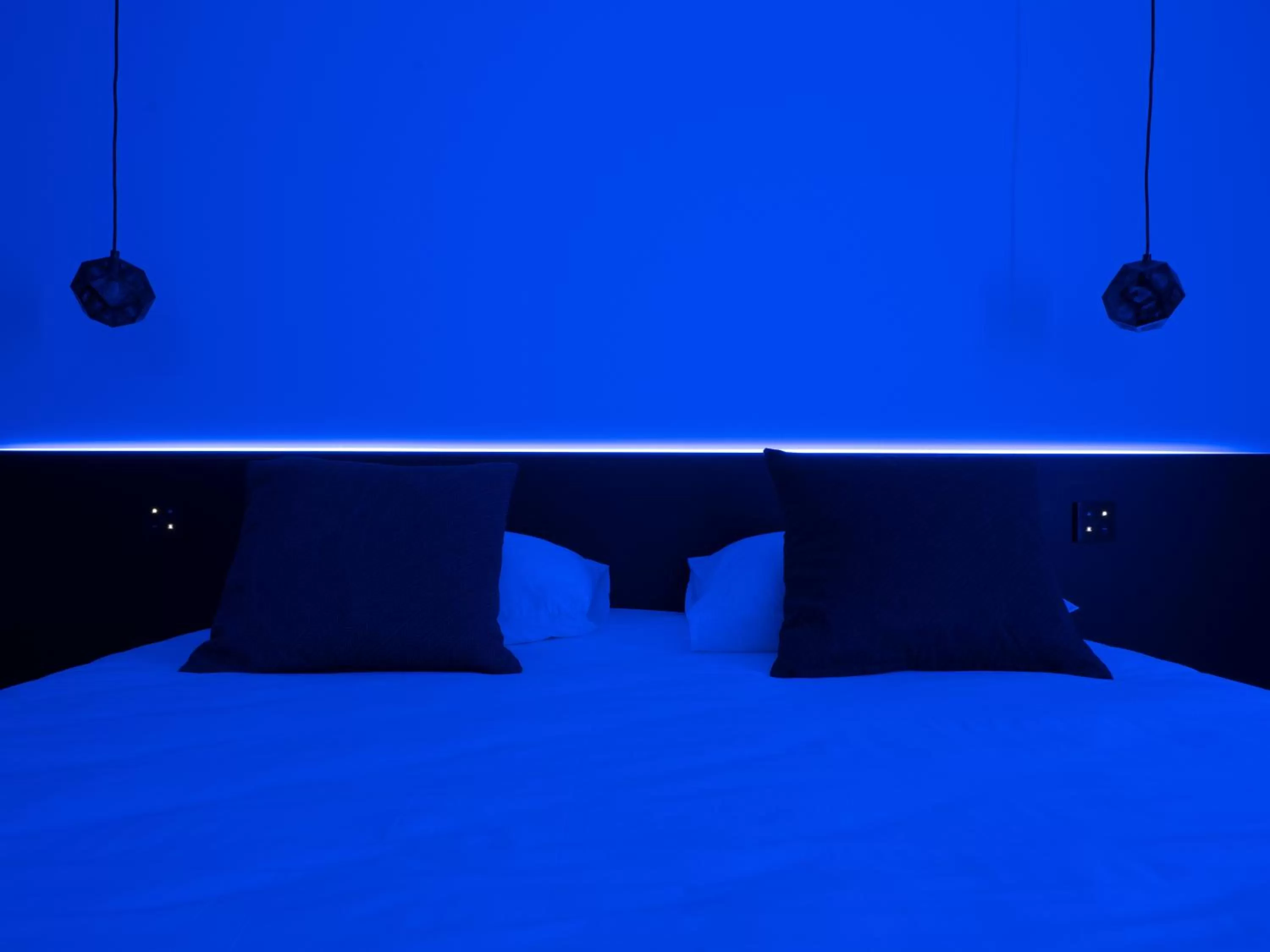 Bed in MiHotel Vieux Lyon