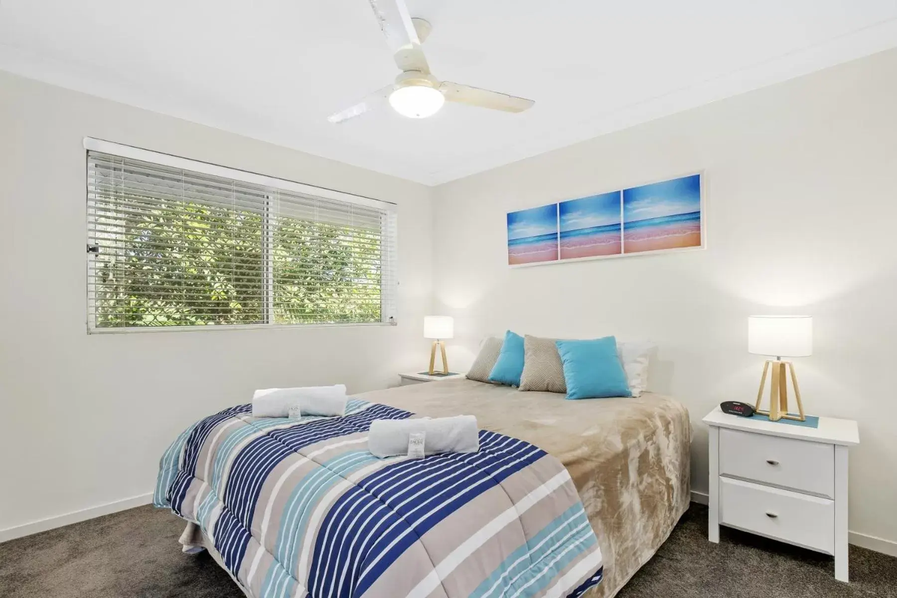 Bed in Kirra Palms Holiday Apartments