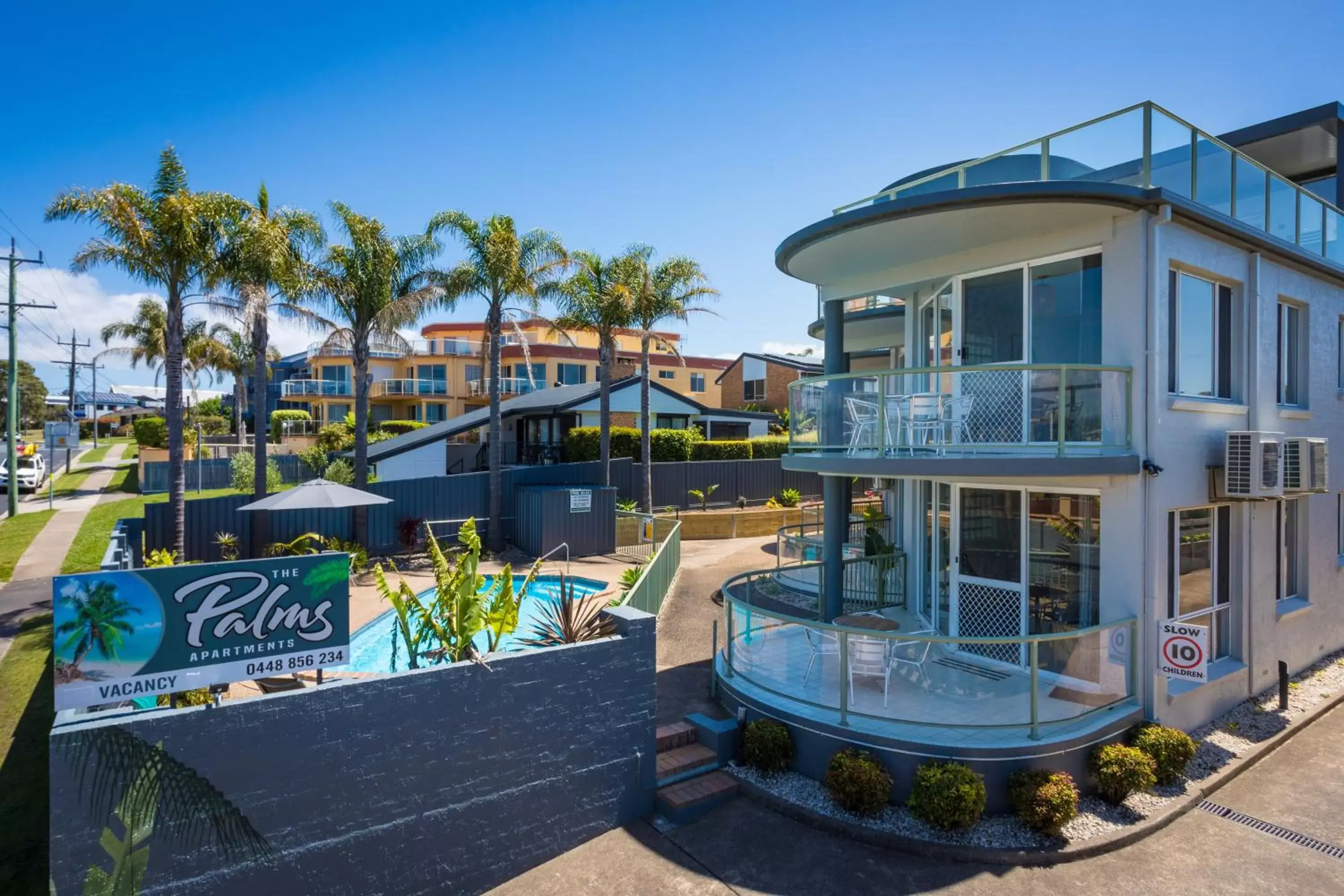 Property building, Swimming Pool in The Palms Apartments