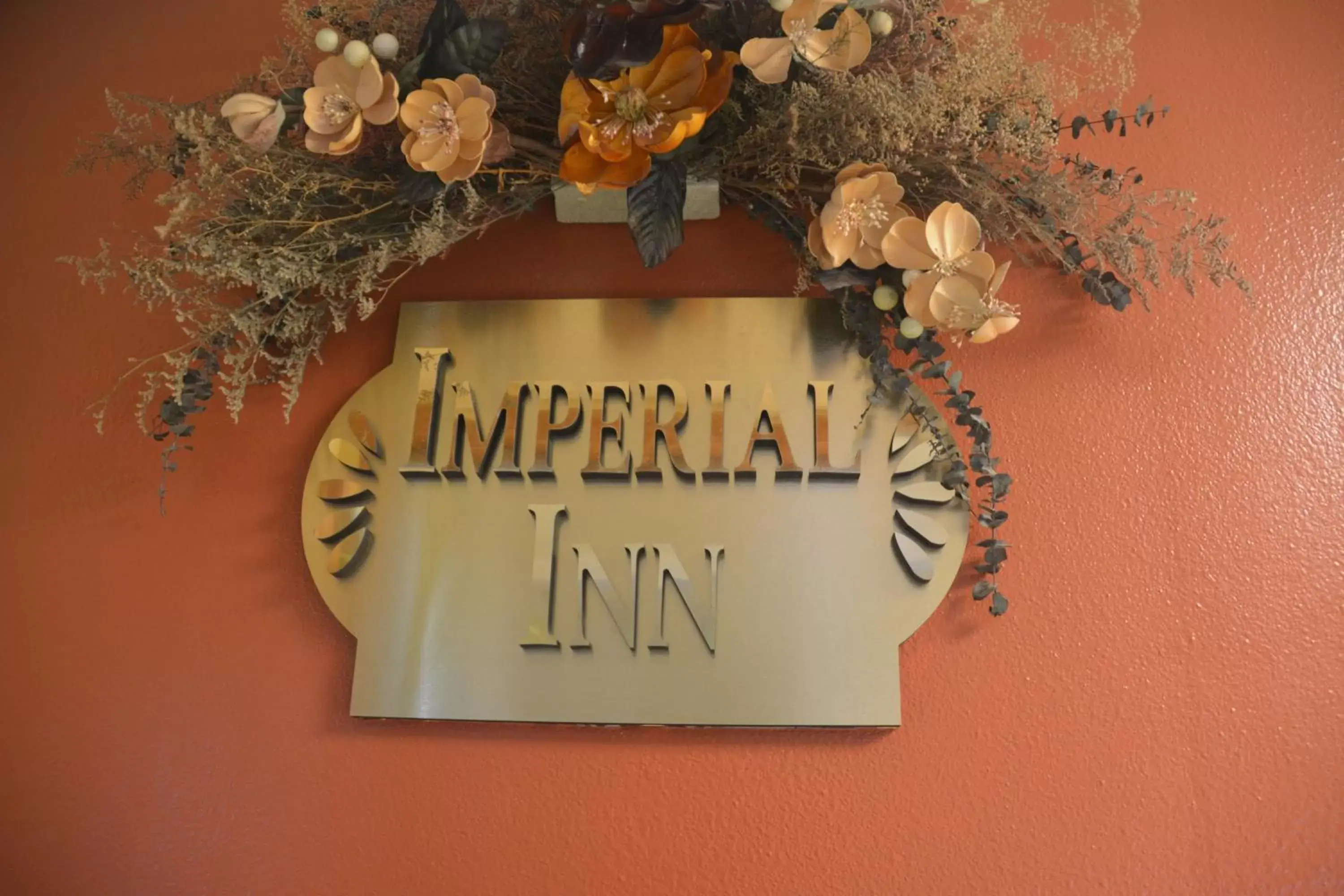 Property logo or sign in Imperial Inn Oakland
