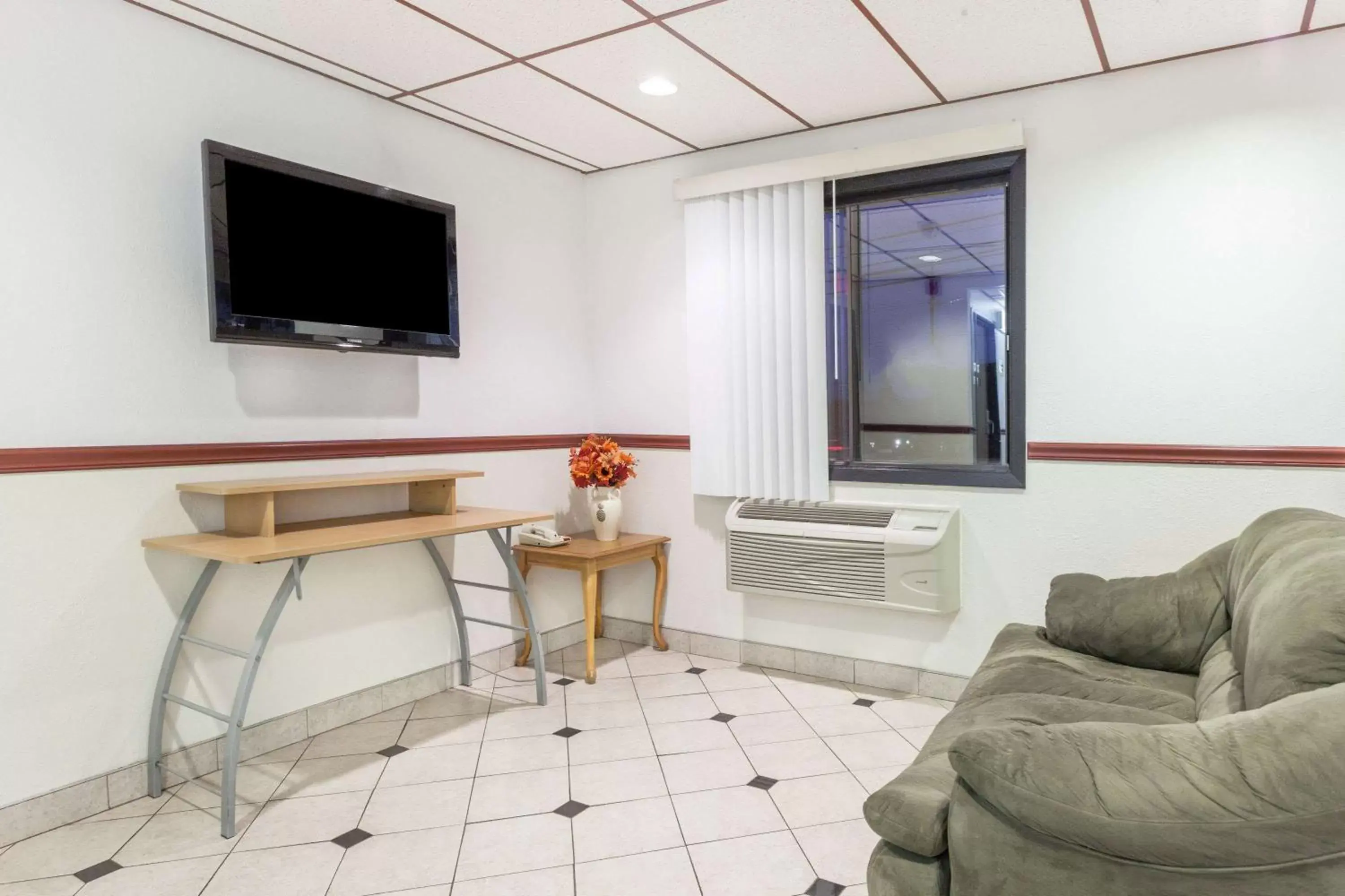 Lobby or reception in Super 8 by Wyndham Winchester VA Lobby or reception in Super 8 by Wyndham Winchester VA