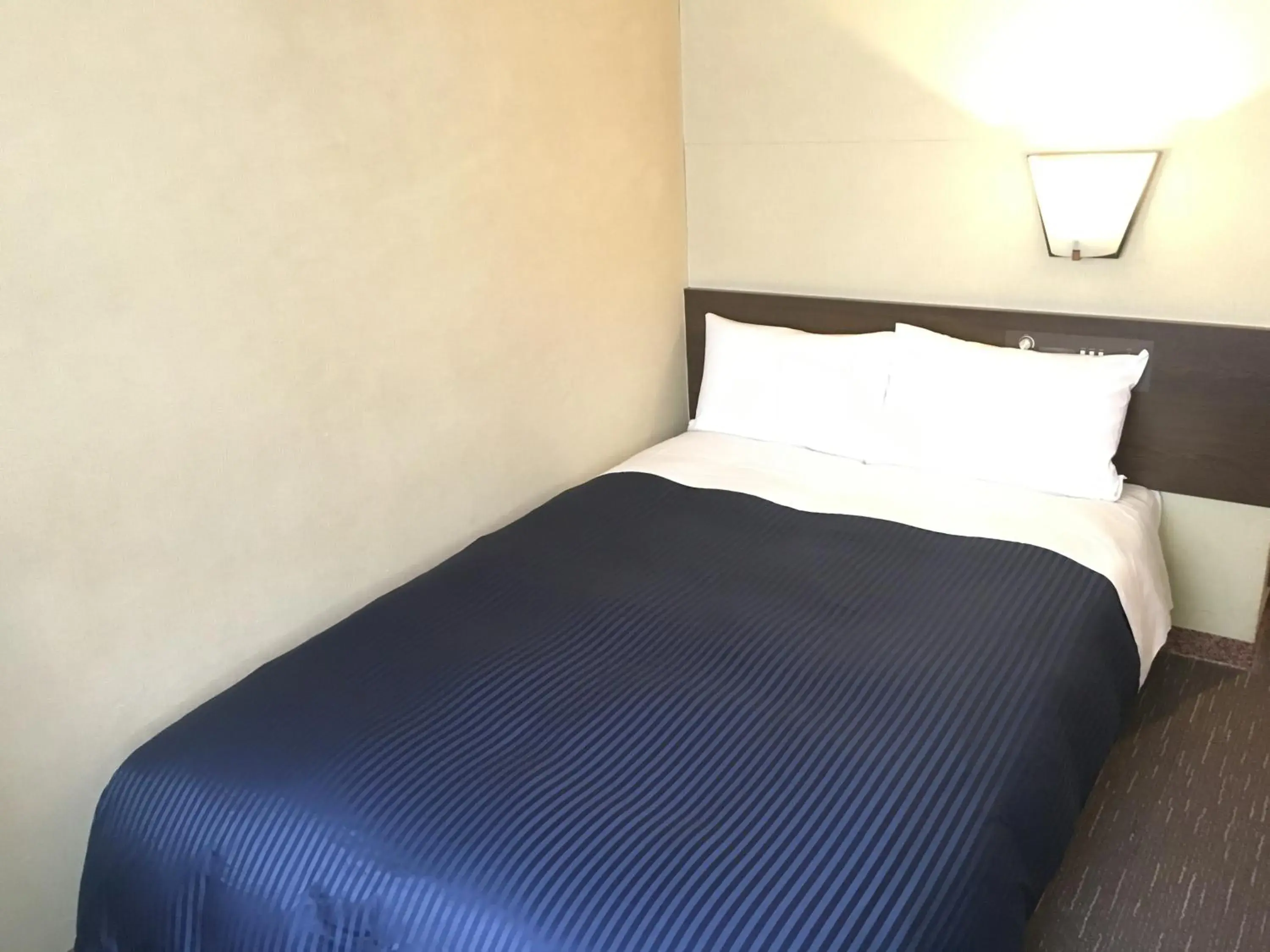 Bed in HOTEL LiVEMAX BUDGET Chofu-Ekimae