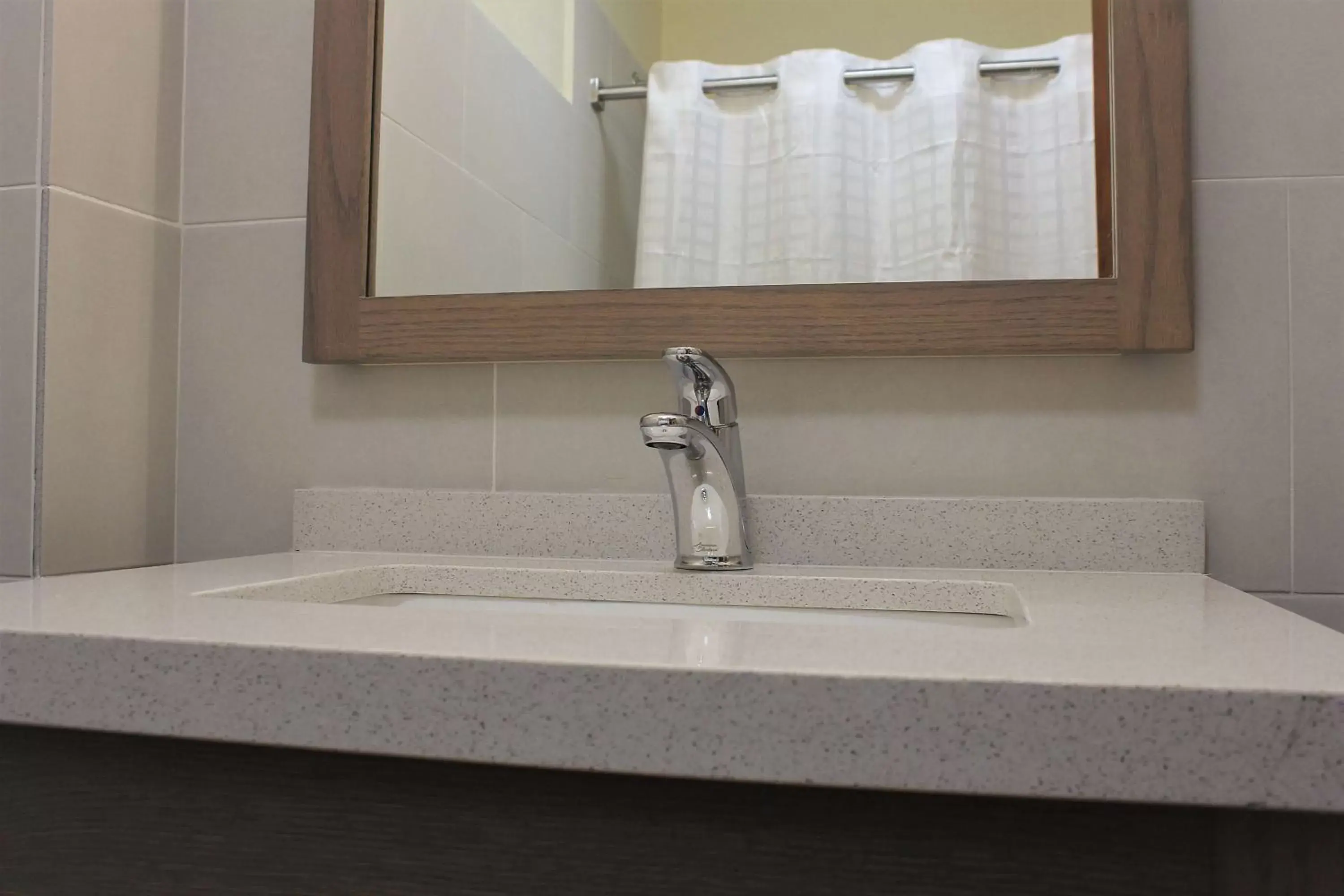 Bathroom in Mayaguez Plaza Hotel; SureStay Collection by Best Western