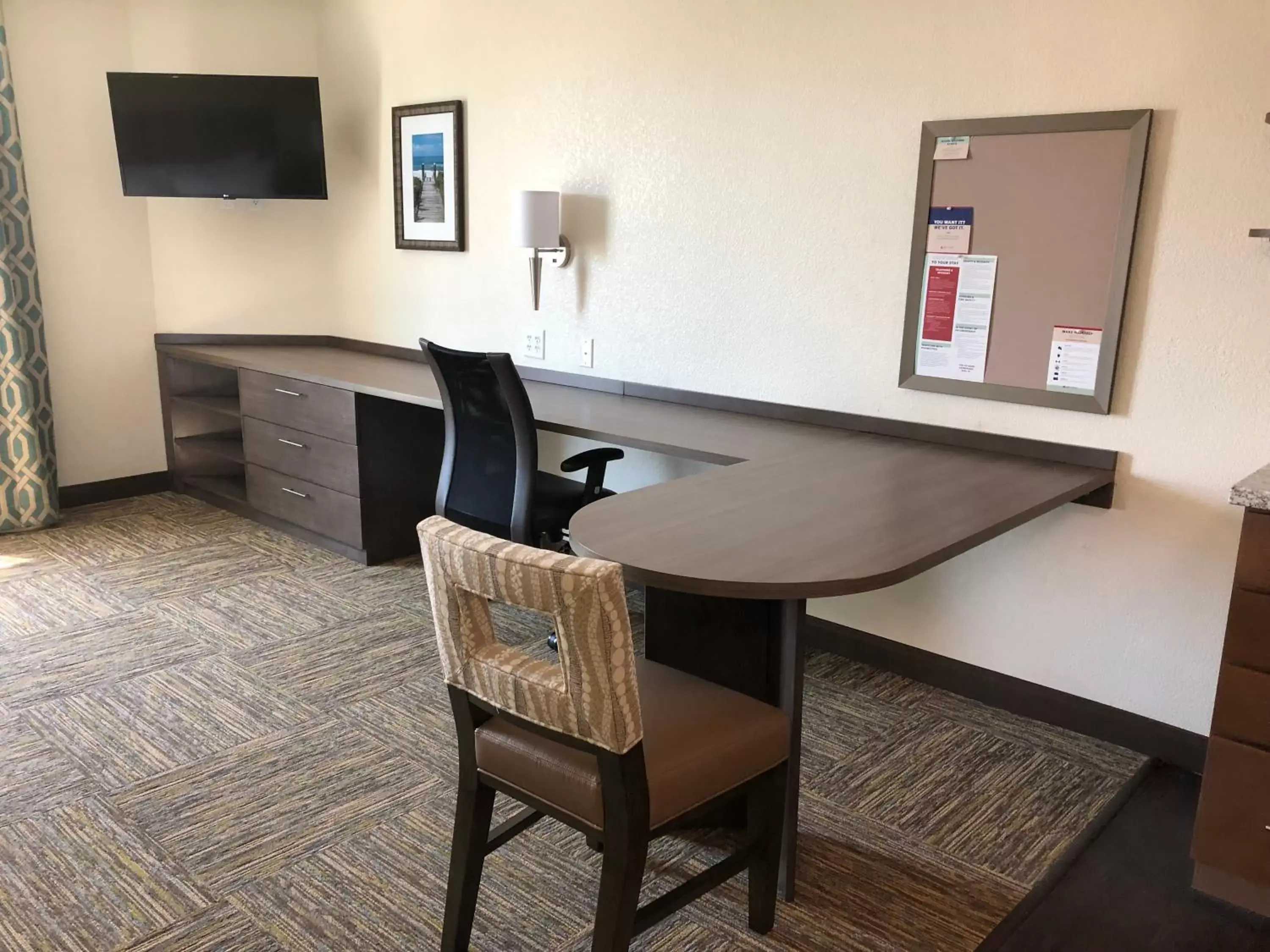 Dining area, TV/Entertainment Center in Candlewood Suites - Panama City Beach Pier Park, an IHG Hotel