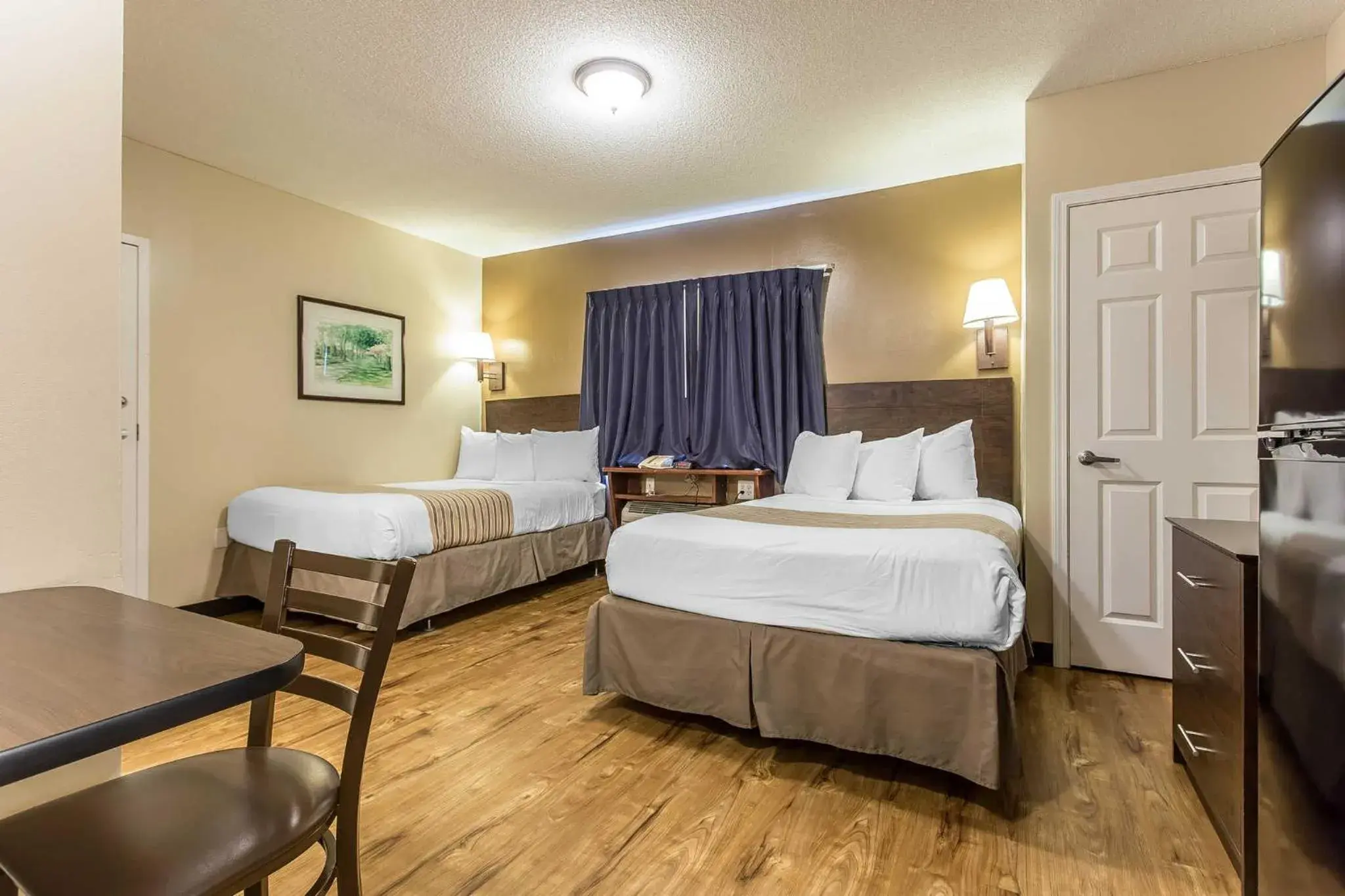 Photo of the whole room, Bed in Suburban Studios near University of North Carolina-Charlotte Photo of the whole room, Bed in Suburban Studios near University of North Carolina-Charlotte