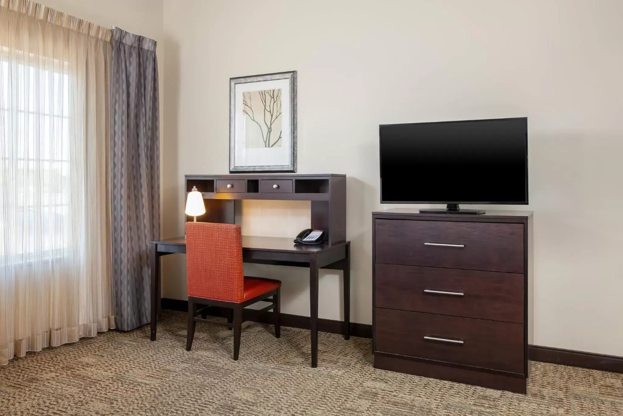Photo of the whole room, TV/Entertainment Center in Staybridge Suites Denver - Central Park, an IHG Hotel
