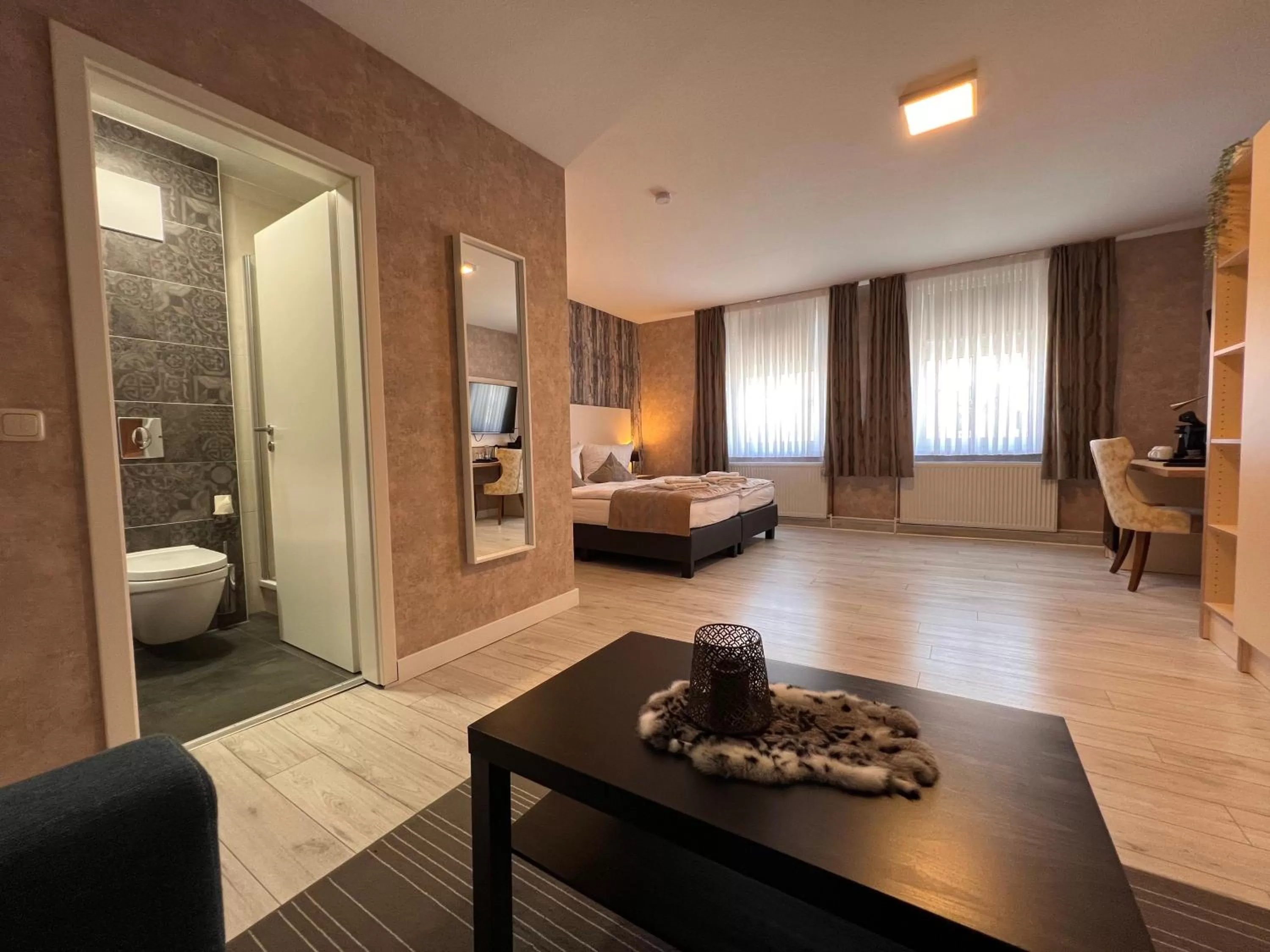 Toilet, Bed in Novel Hotel