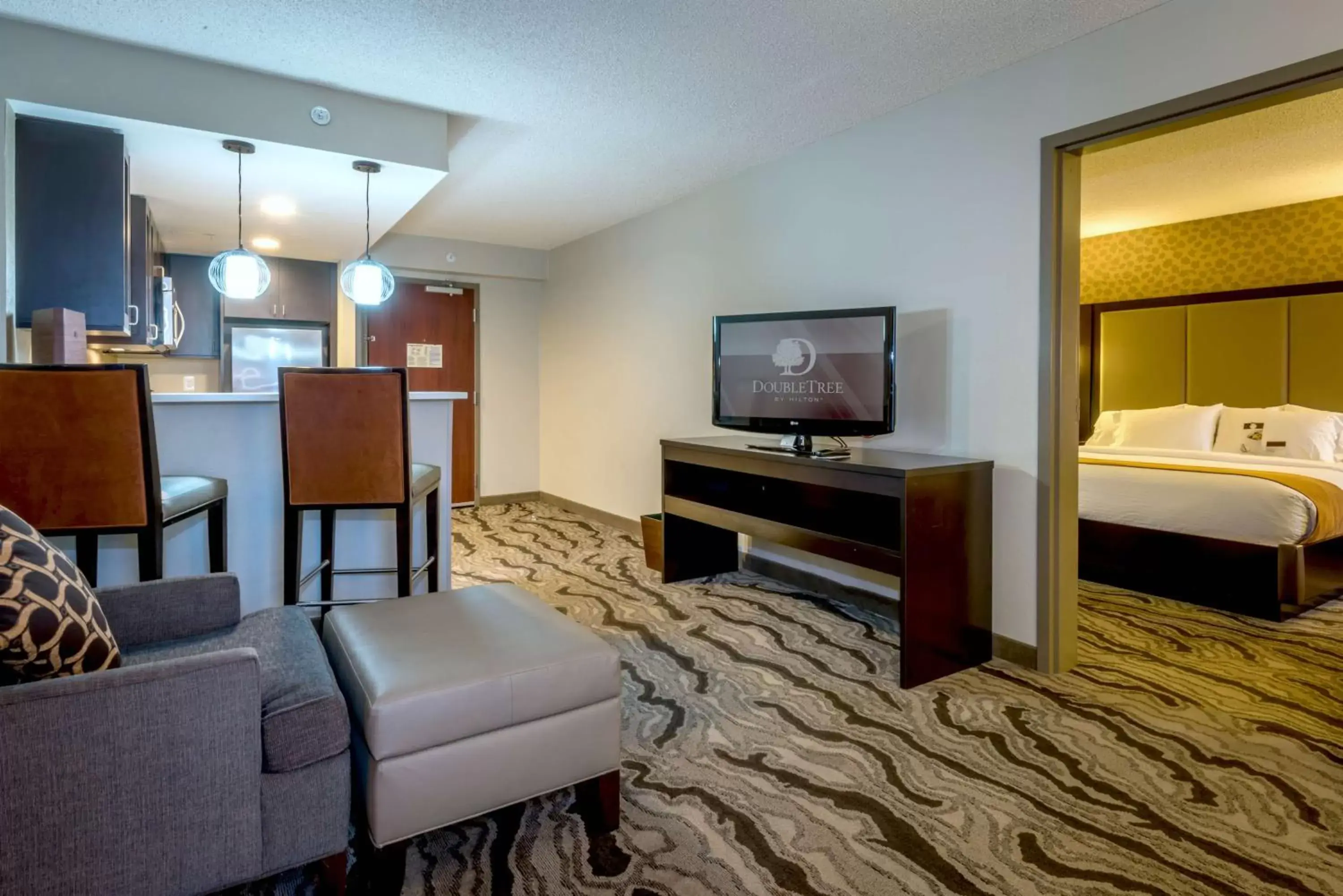 Living room, TV/Entertainment Center in DoubleTree by Hilton Montgomery Downtown