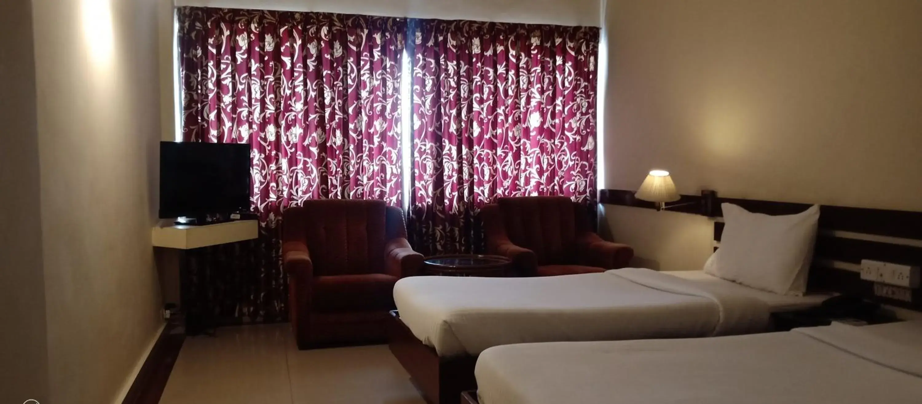 Photo of the whole room, Bed in Hotel Poonja International