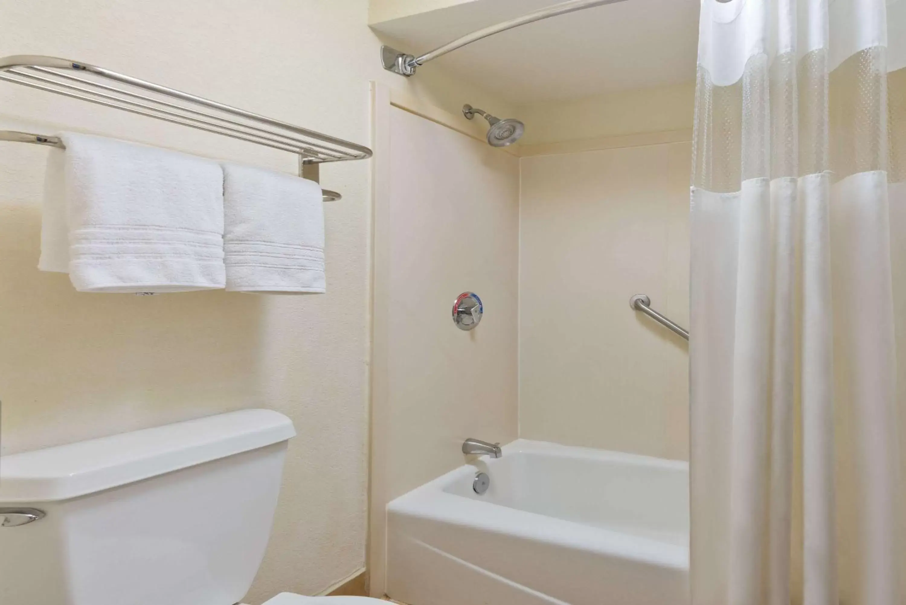 Bathroom in Super 8 by Wyndham Huntersville/Charlotte Area