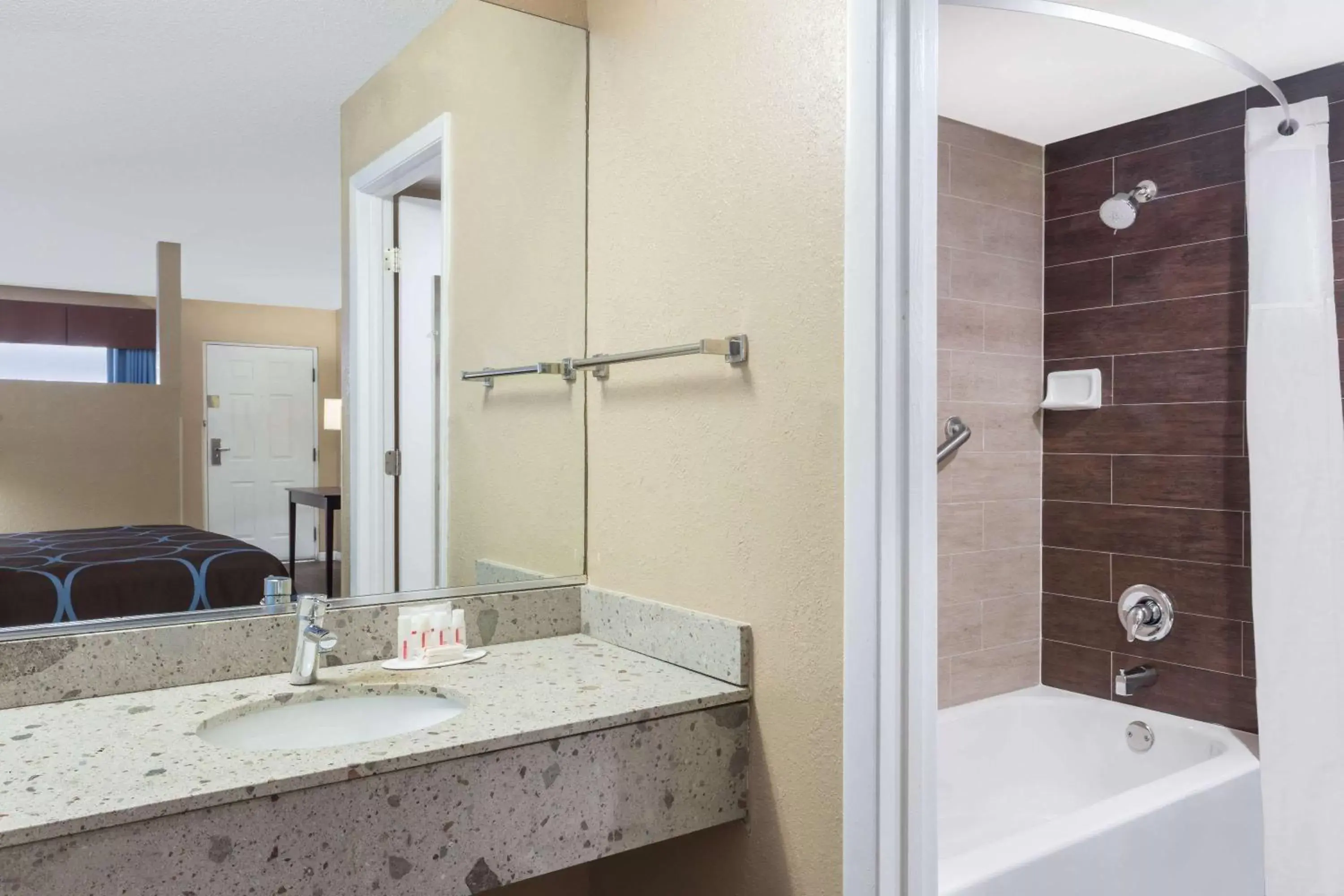 Bathroom in Super 8 by Wyndham Ellenton Bradenton Area