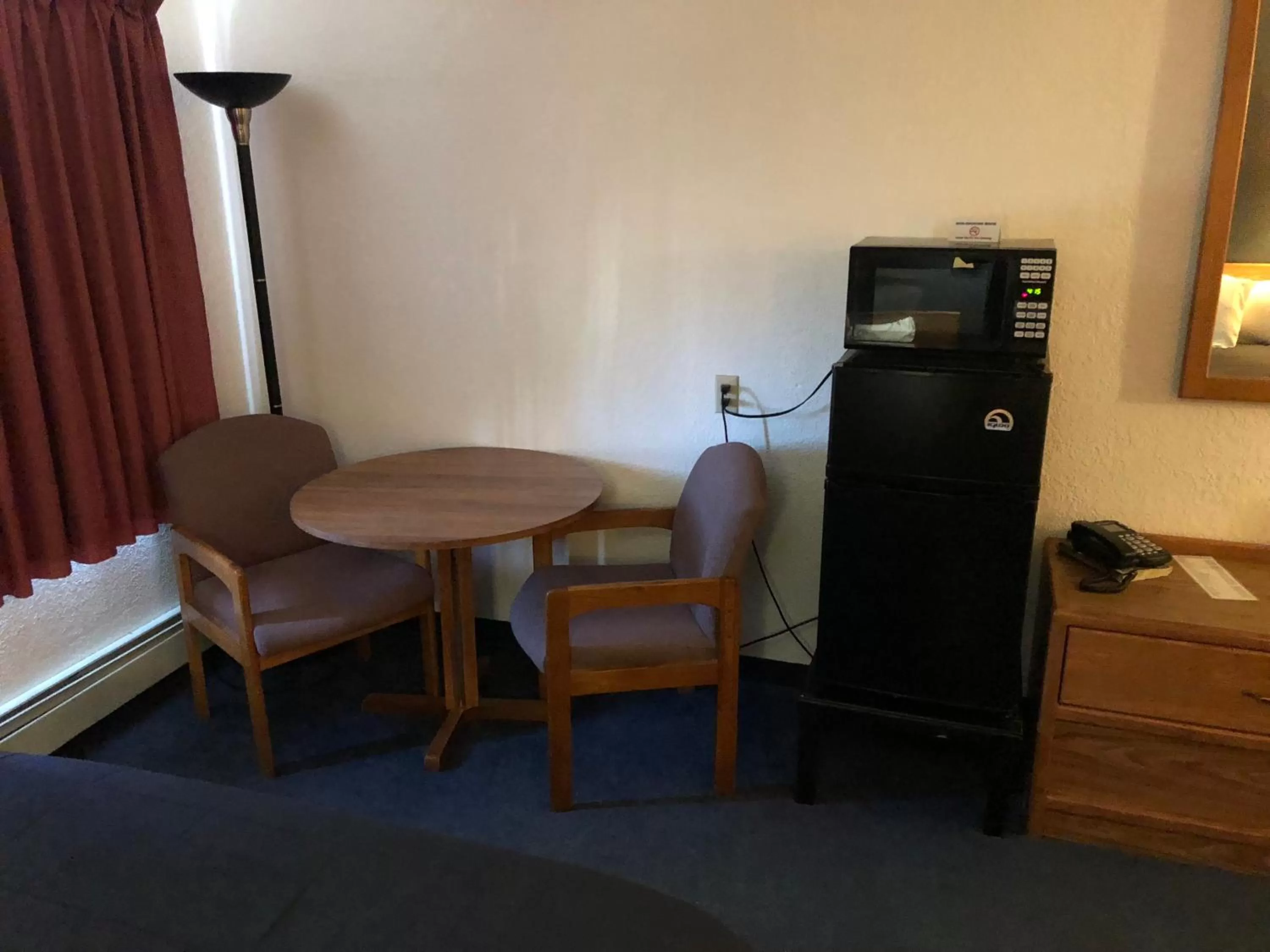 Dining area, TV/Entertainment Center in AmericInn Motel - Monticello