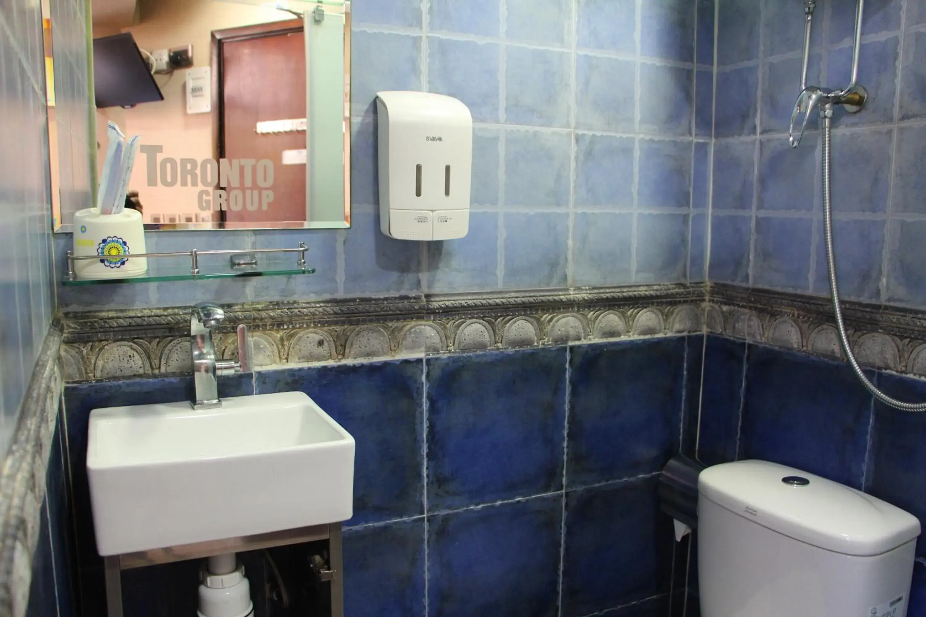 Toilet, Bathroom in Temple Street Hotel - Toronto Motel Group
