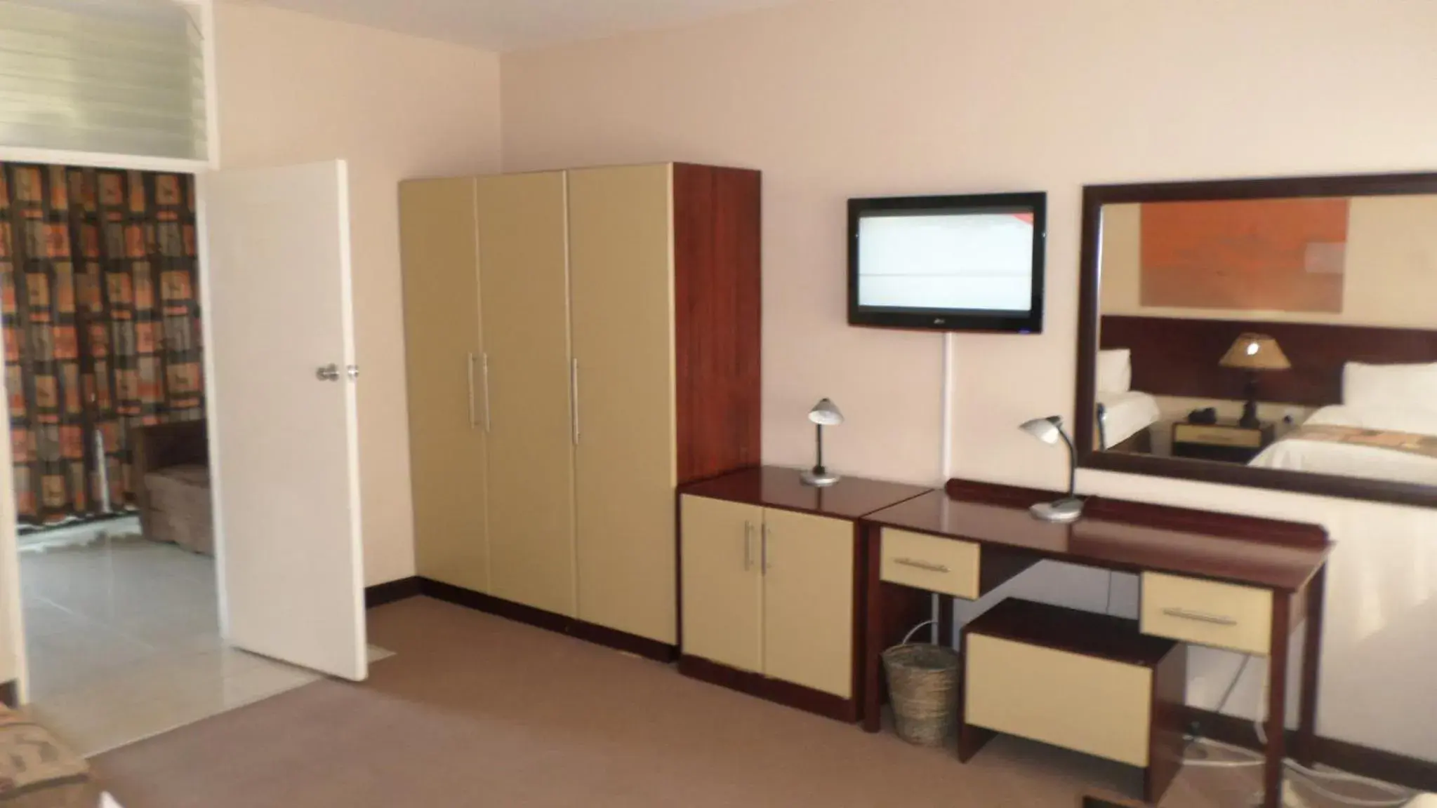 Photo of the whole room, TV/Entertainment Center in Coastlands Durban Self Catering Holiday Apartments