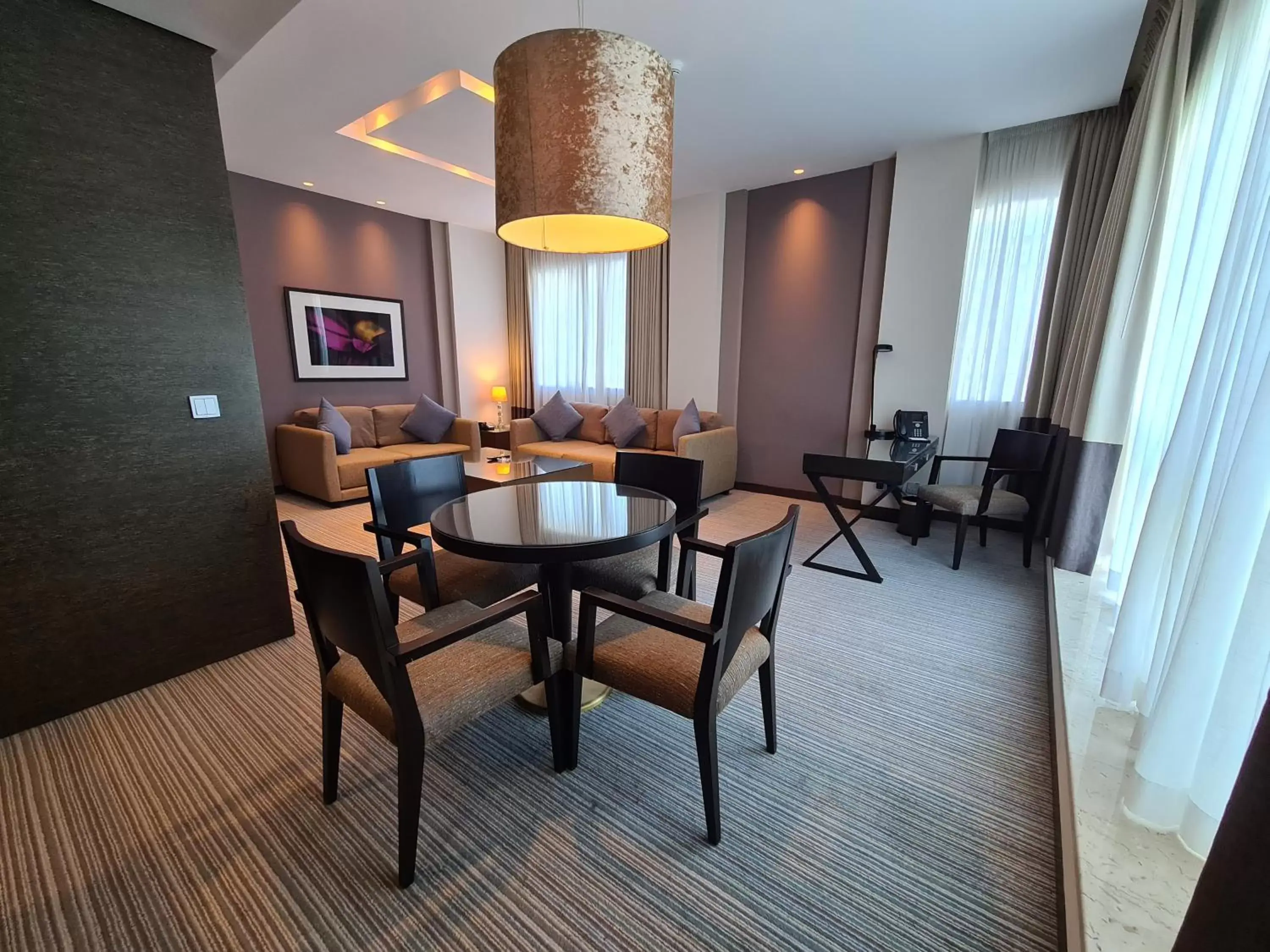 Living room, Dining Area in Hili Rayhaan by Rotana