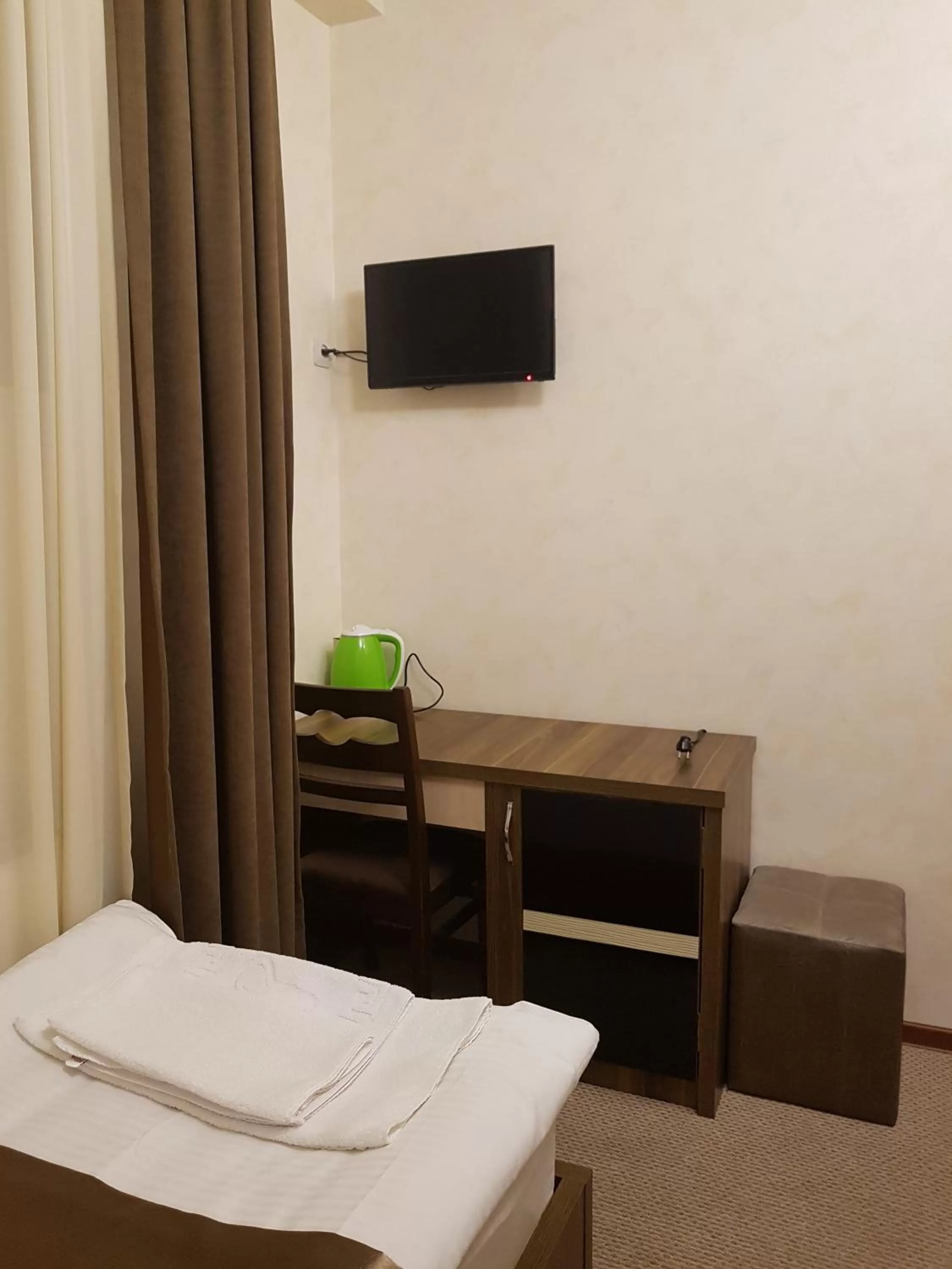 Bed, TV/Entertainment Center in villa old sololaki