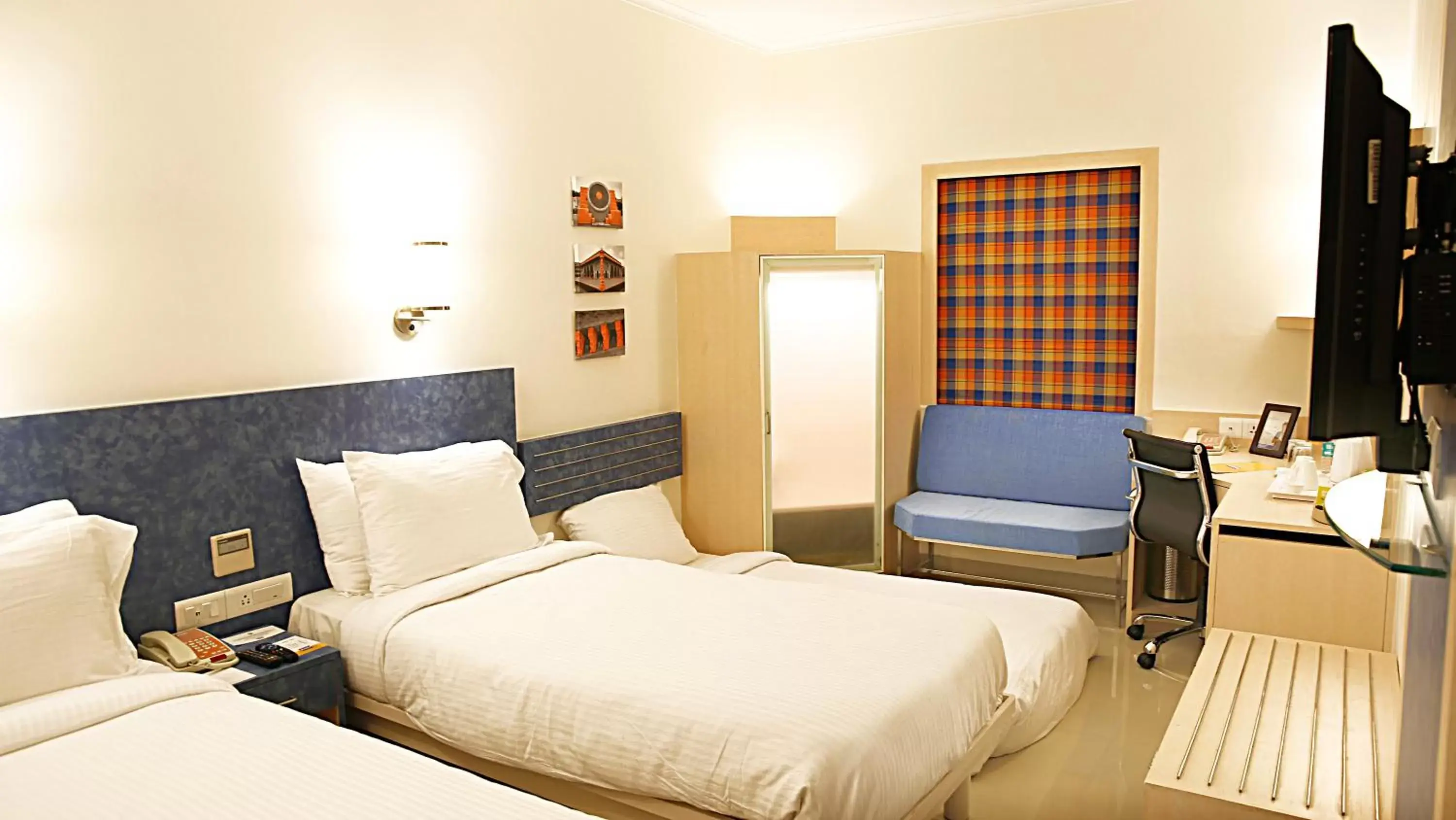 Bed in Nirwana Hometel Jaipur- A Sarovar Hotel