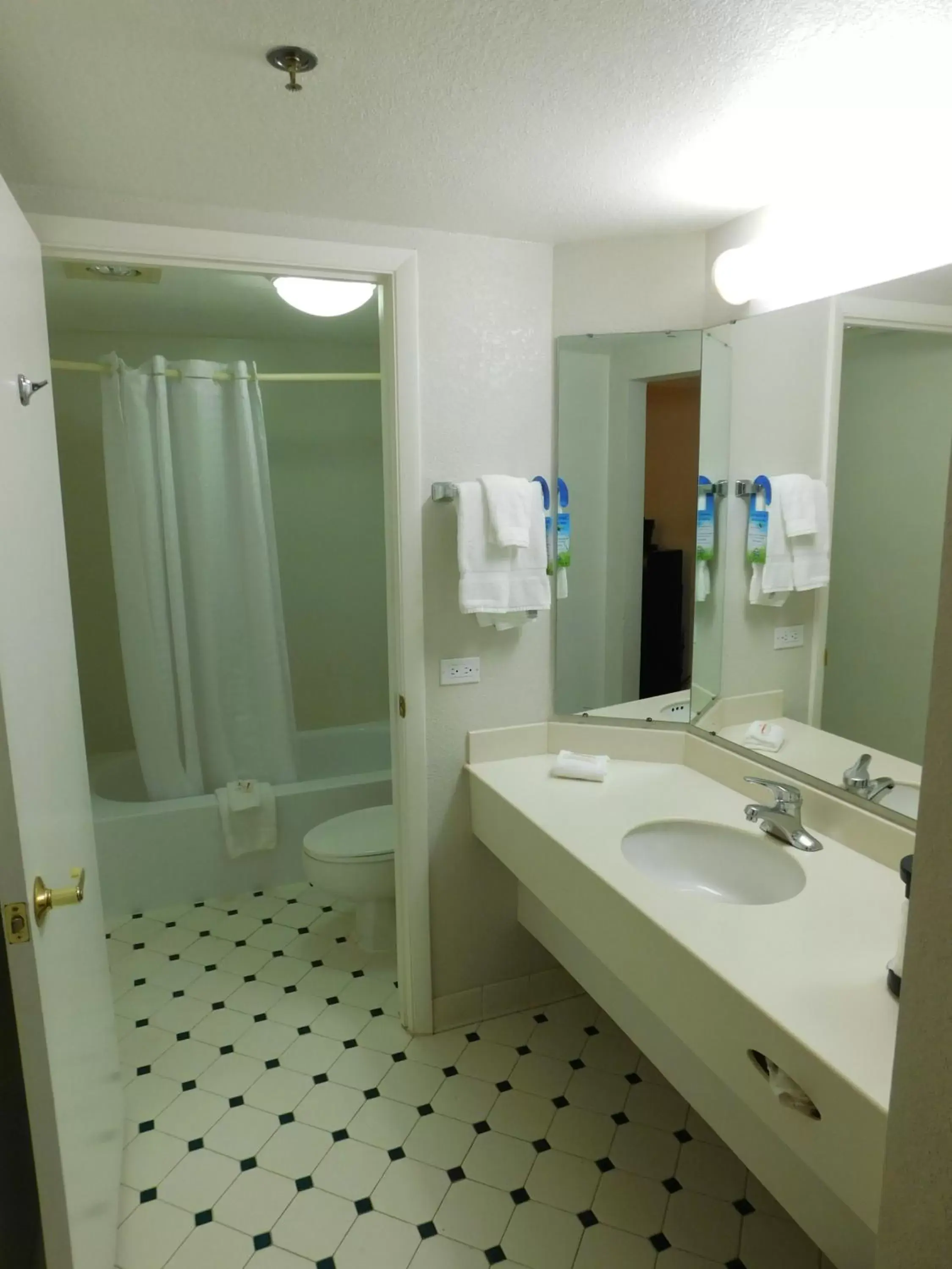 Bathroom in Days Inn & Suites by Wyndham Arlington Heights