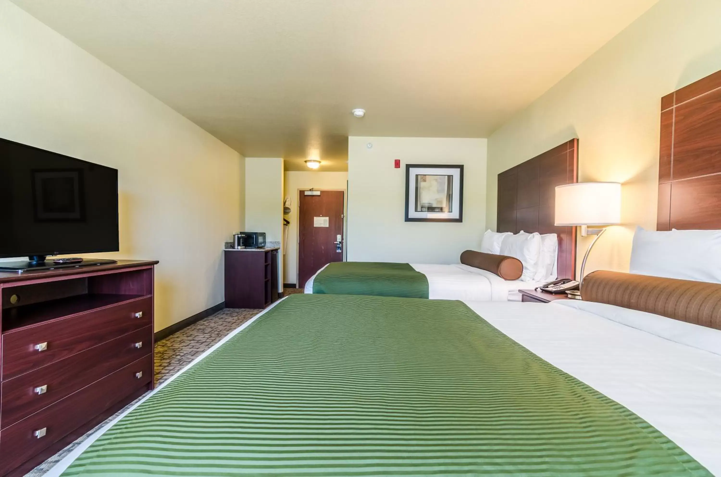 Bed in Cobblestone Inn & Suites - Barron