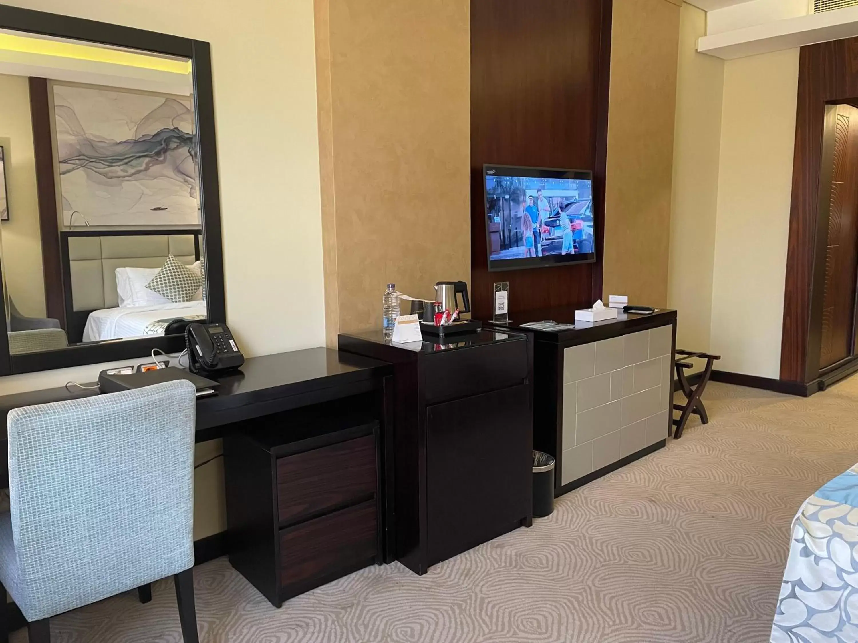 Photo of the whole room, TV/Entertainment Center in Triumph Luxury Hotel