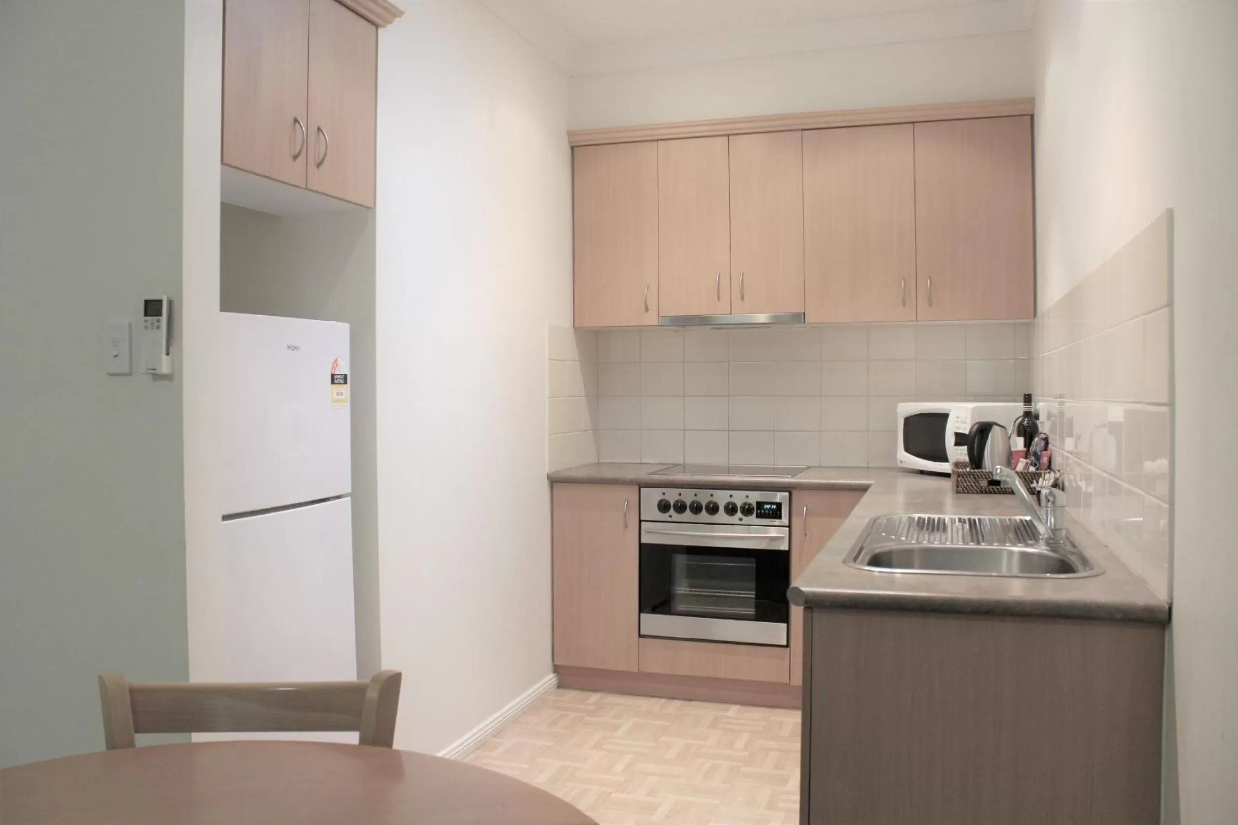 Kitchen or kitchenette in Carlyle Suites & Apartments