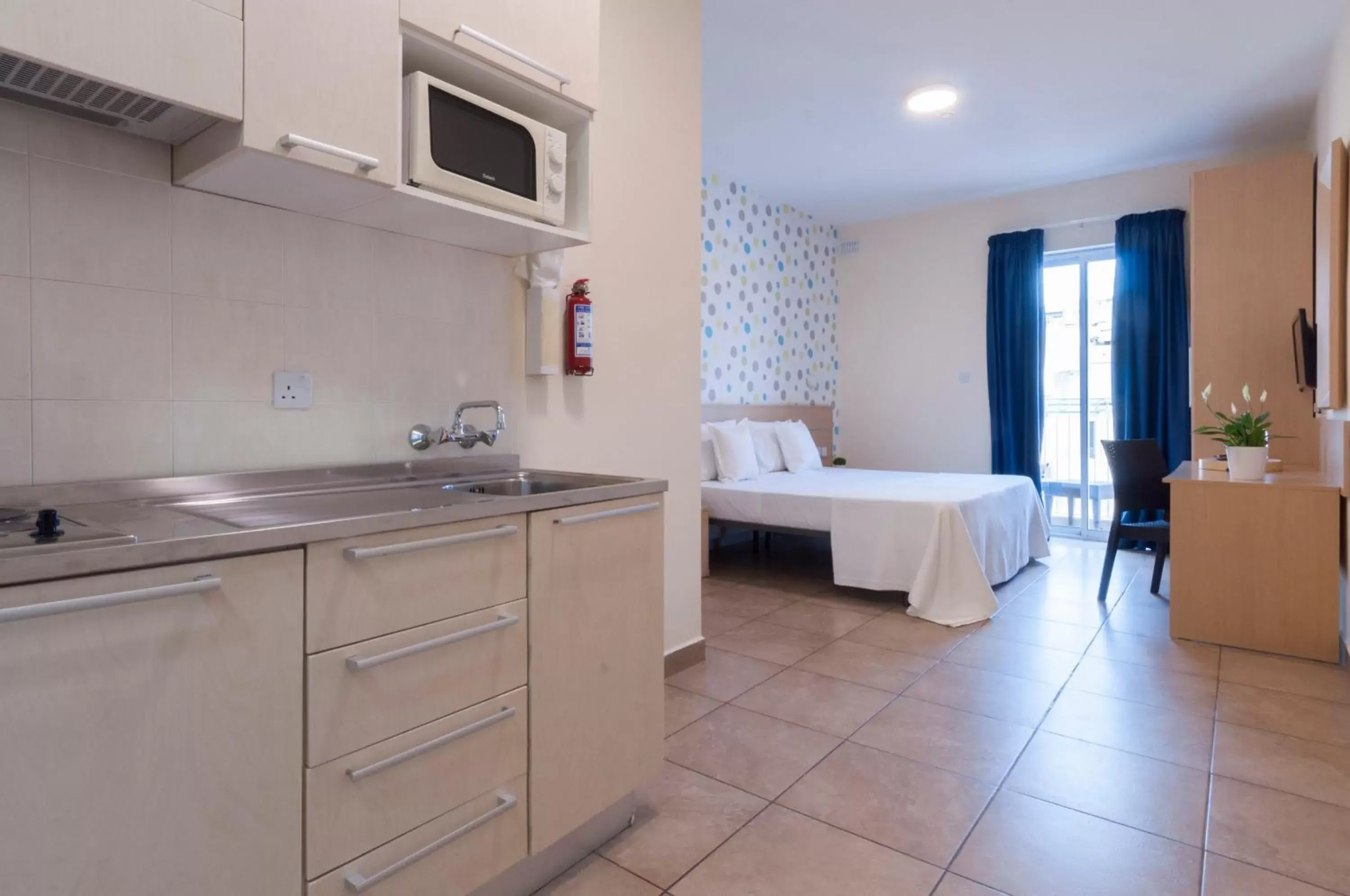 Photo of the whole room, Kitchen/Kitchenette in Blubay Apartments by ST Hotels