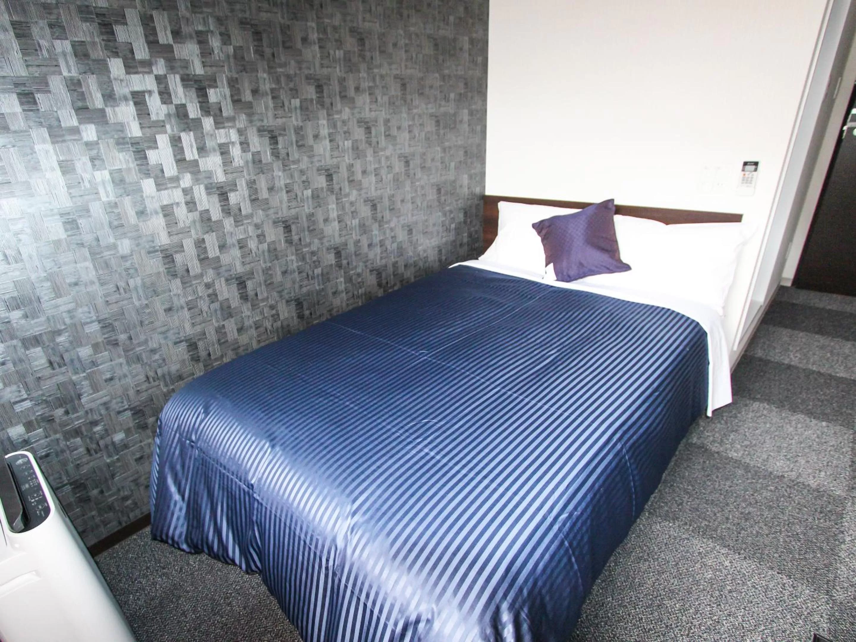 Bed in HOTEL LiVEMAX PREMIUM Himejieki-Minami