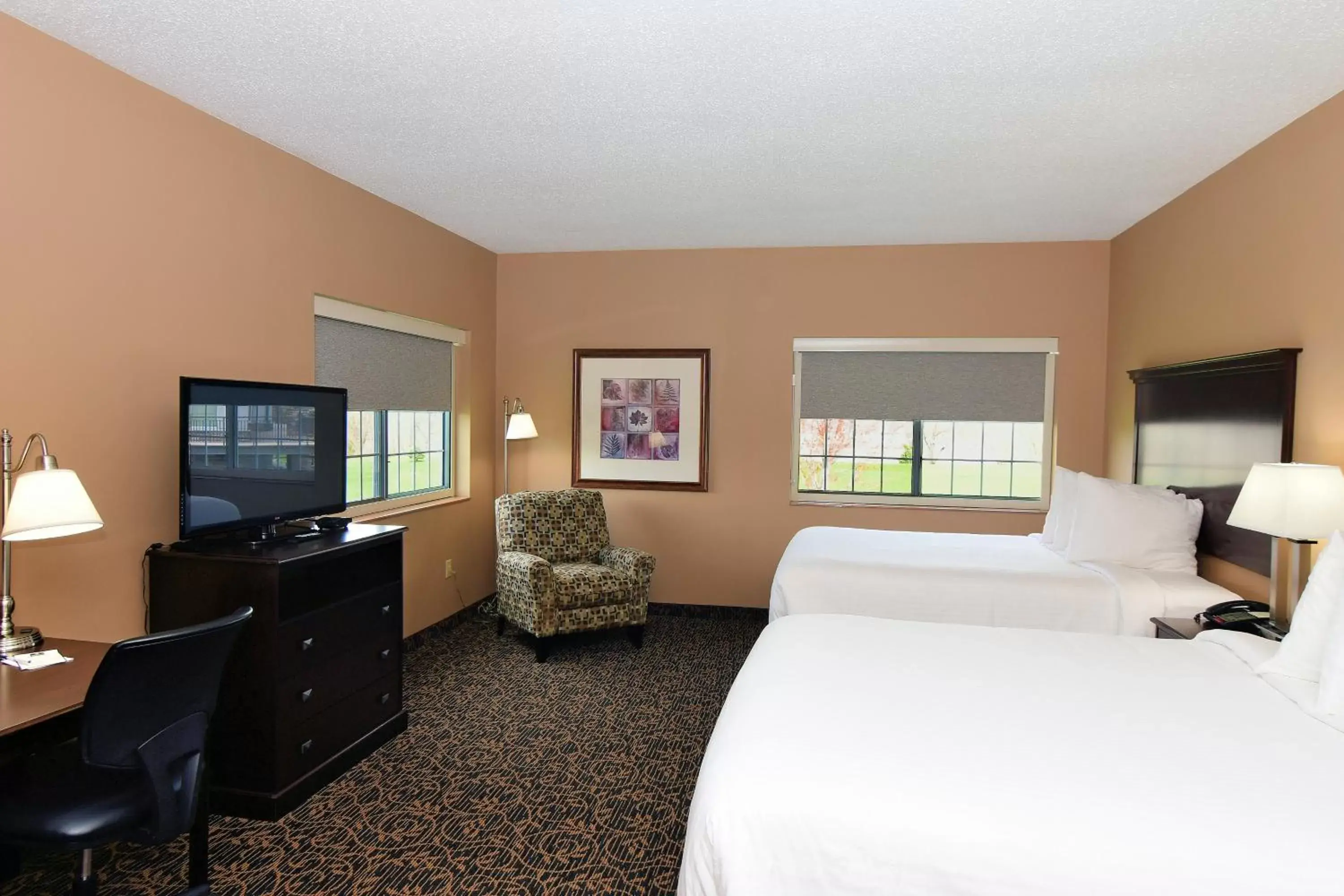 Bed, TV/Entertainment Center in Cobblestone Inn & Suites - Denison | Majestic Hills