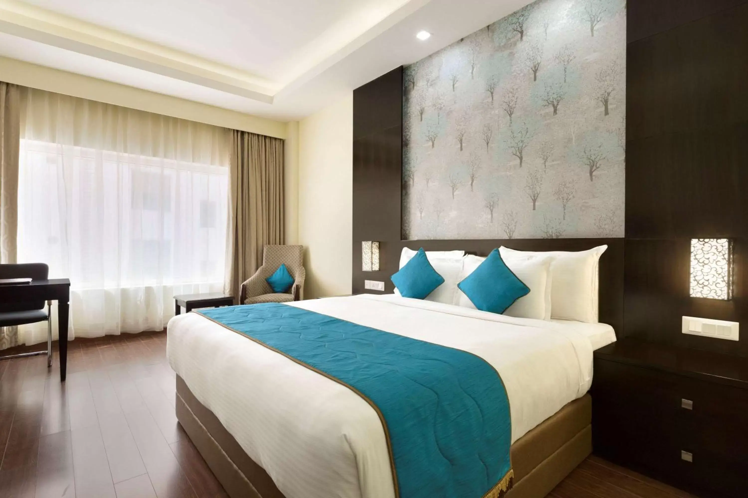 Photo of the whole room, Bed in Ramada Jamshedpur Bistupur