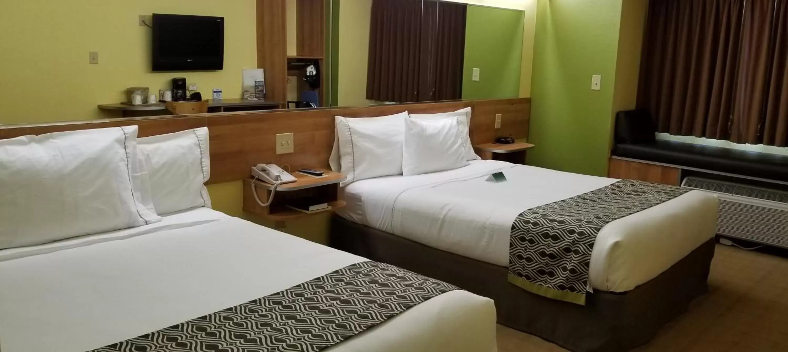 Bed in Microtel Inn & Suites by Wyndham Delphos