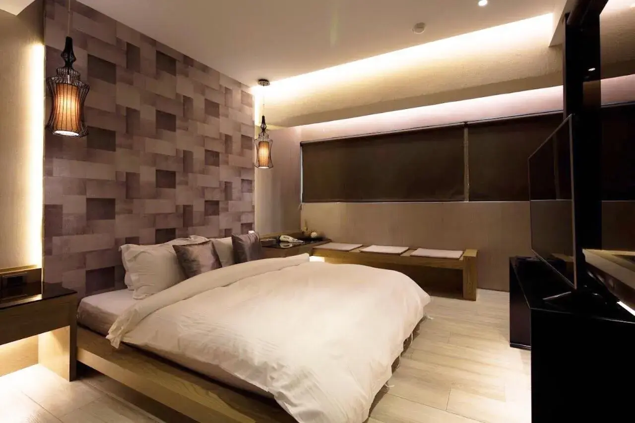 Bed in JBG Hot Spring Resort Hotel