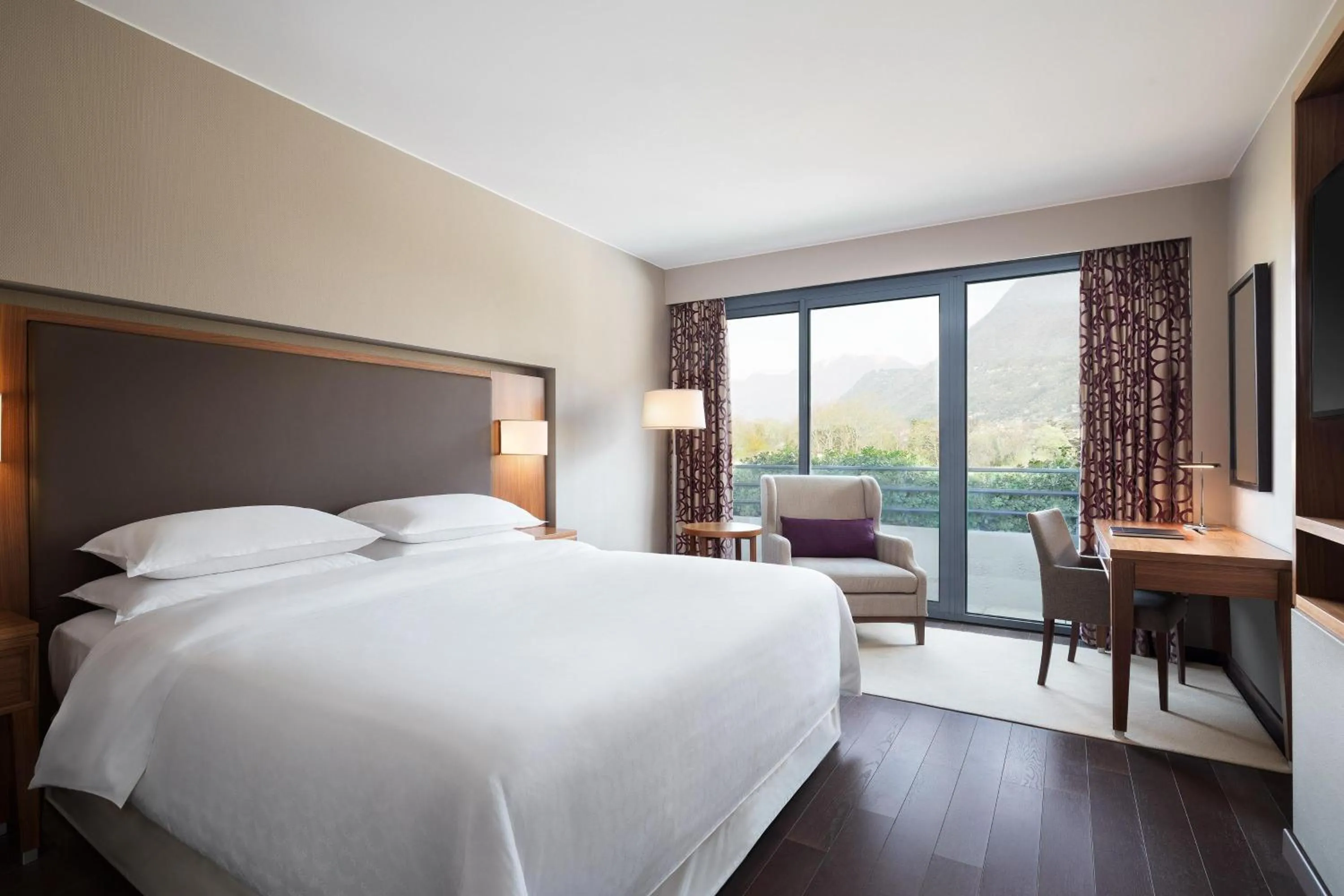 Photo of the whole room, Bed in Sheraton Lake Como Hotel