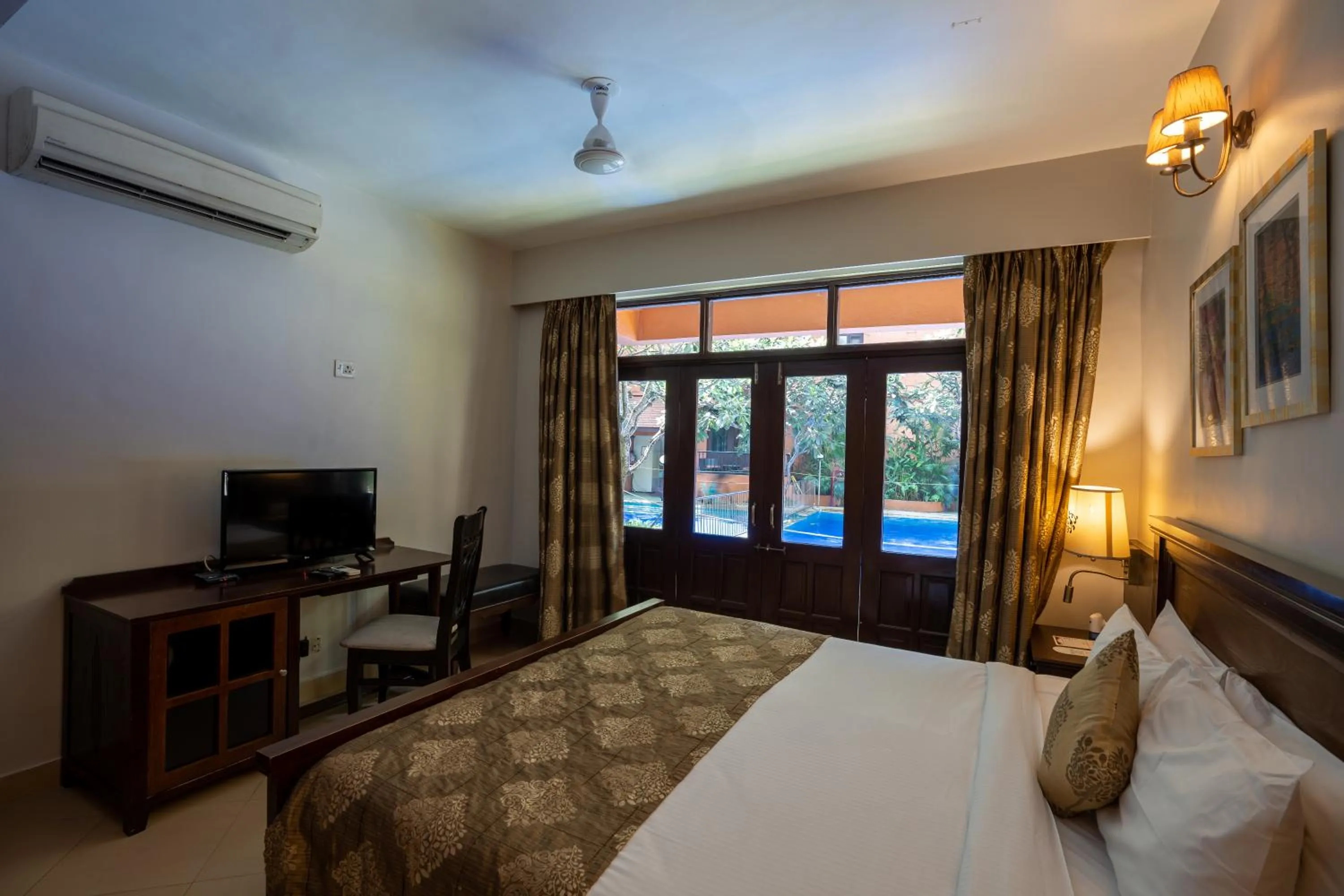 Bed in Neelam's The Grand Hotel Goa