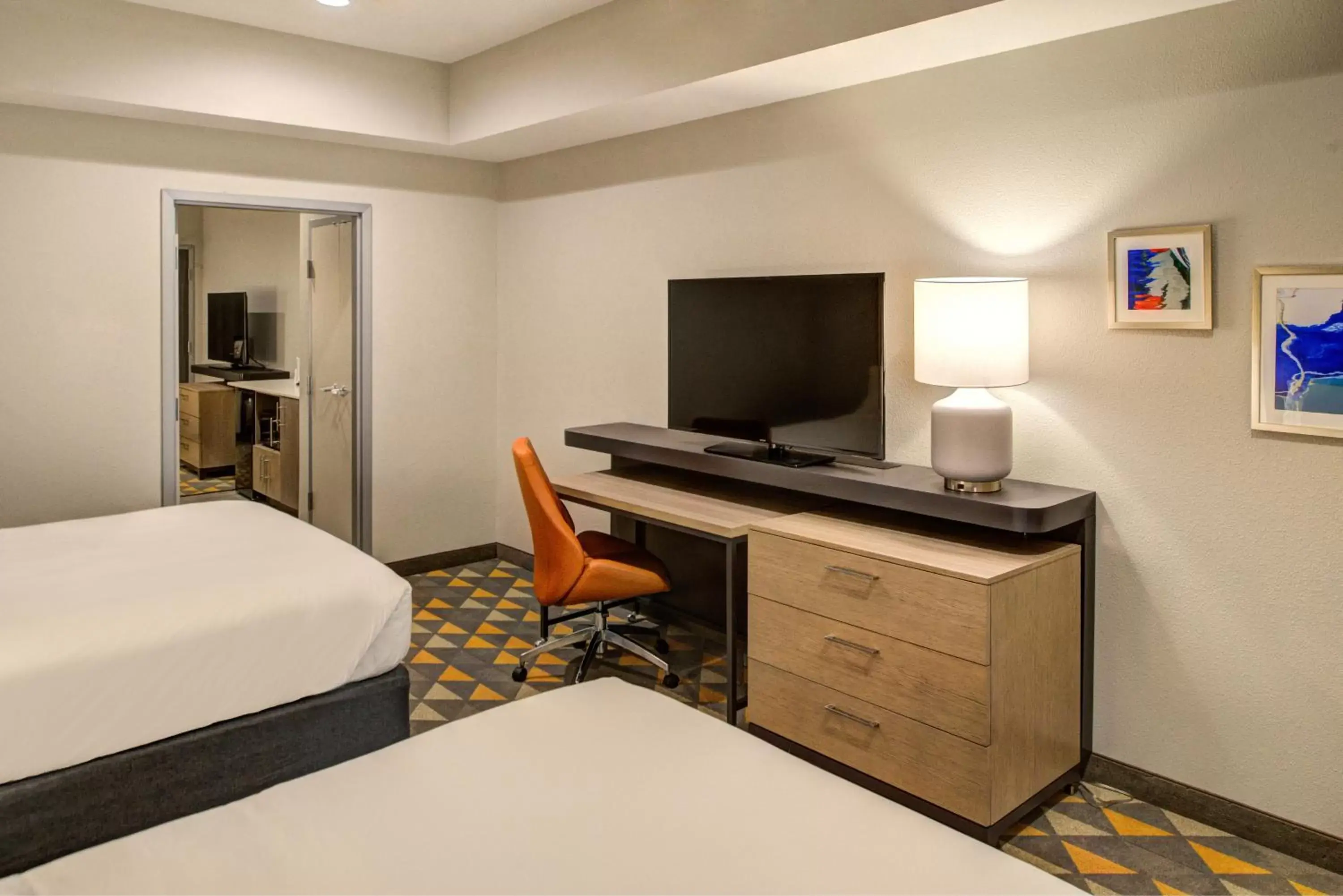 Photo of the whole room, TV/Entertainment Center in Holiday Inn Hotel & Suites - Houston West - Katy Mills, an IHG Hotel