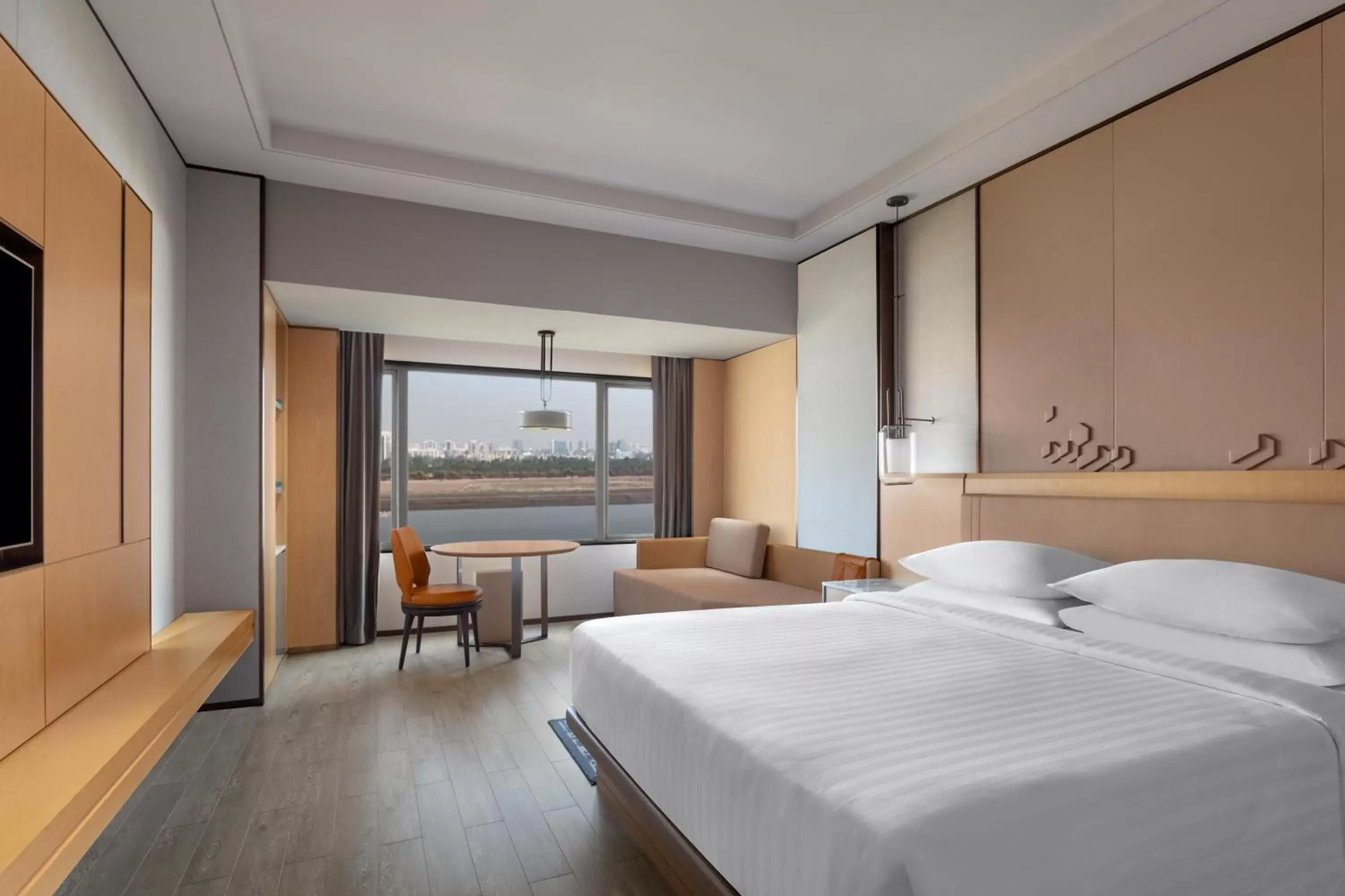 Bed in Surat Marriott Hotel
