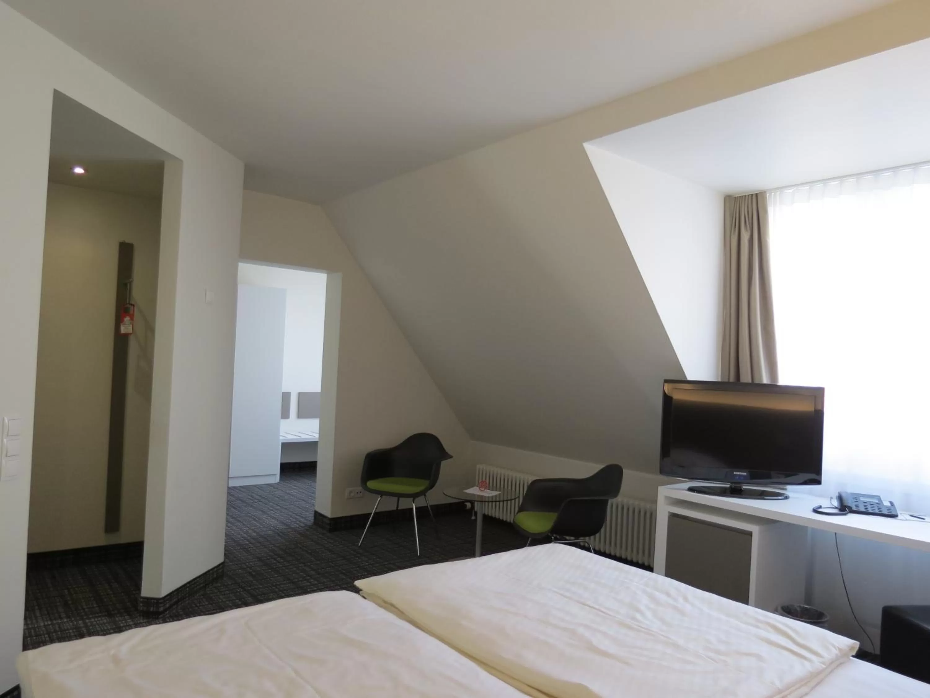 Photo of the whole room, Bed in Comfor Hotel Ulm City