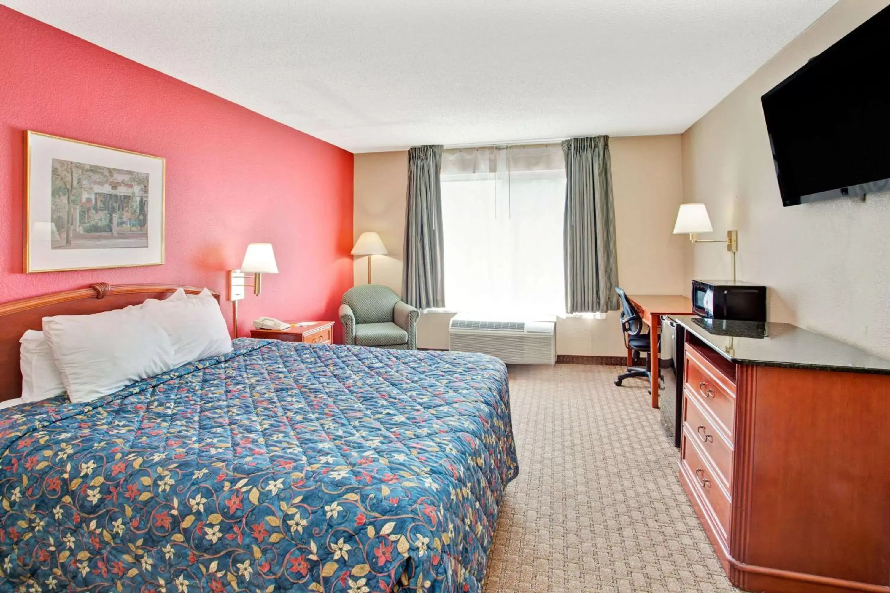 Photo of the whole room, TV/Entertainment Center in Days Inn by Wyndham Marietta-Atlanta-Delk Road