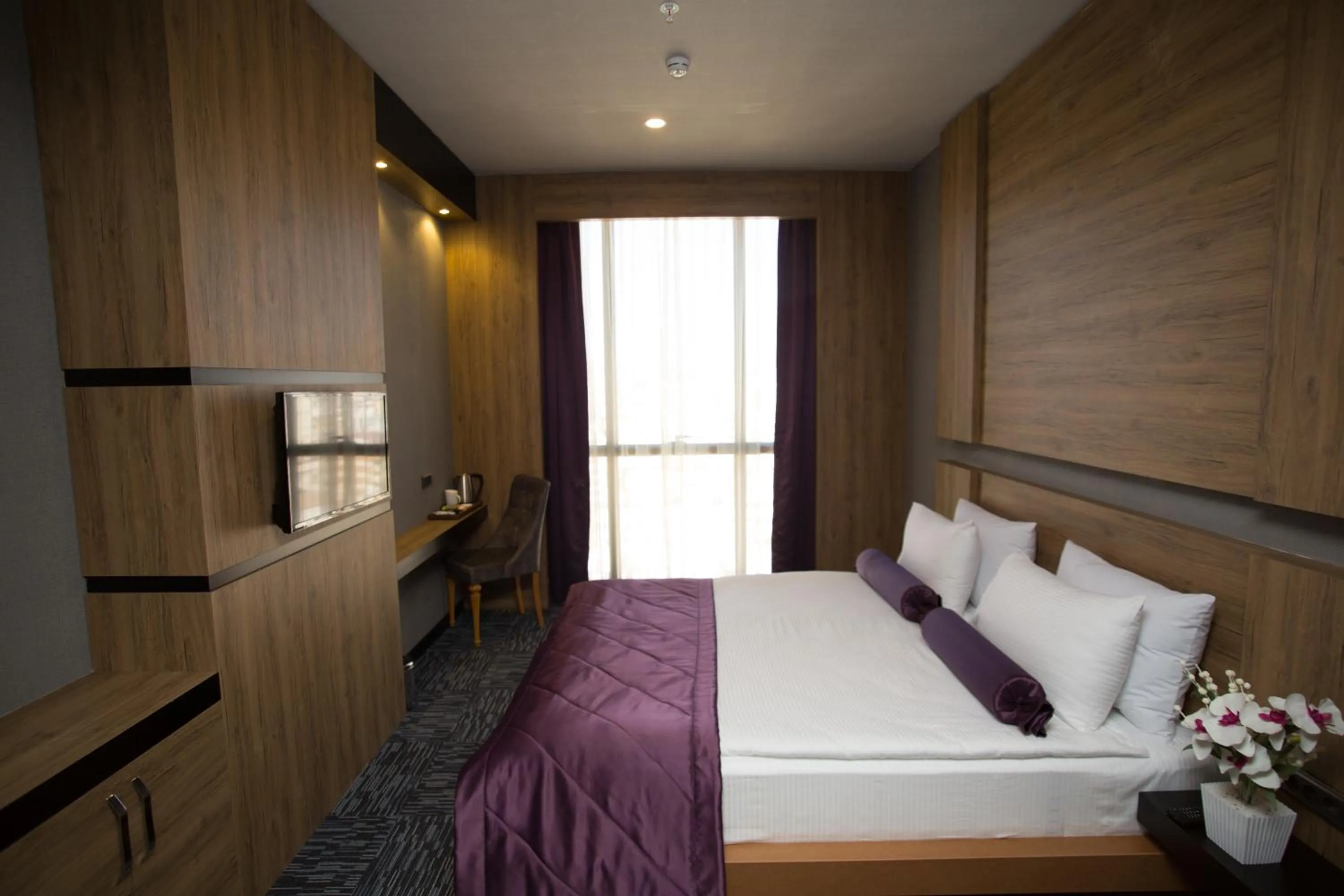 Bedroom in SKY Business Hotel