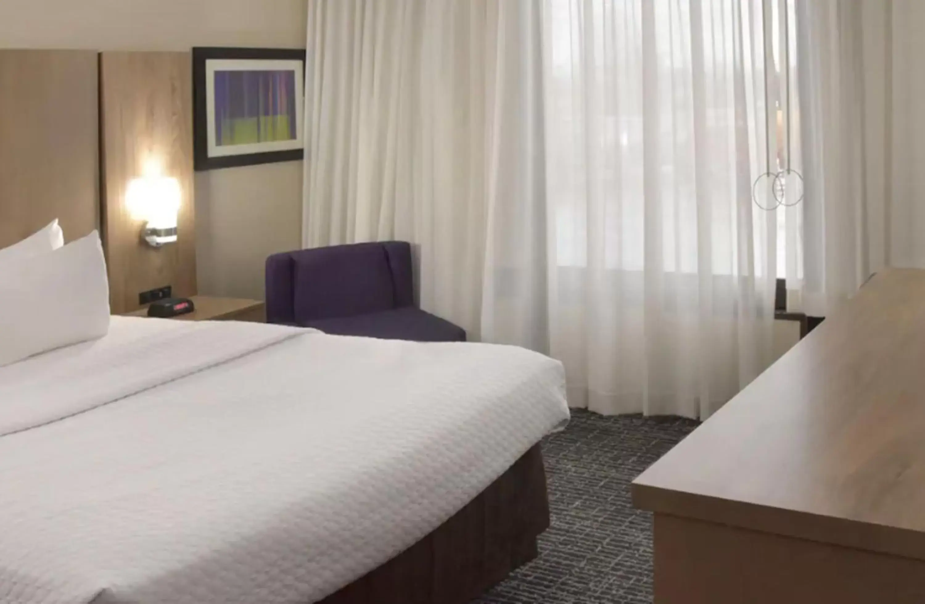 Bed in Crowne Plaza Cleveland Airport, an IHG Hotel