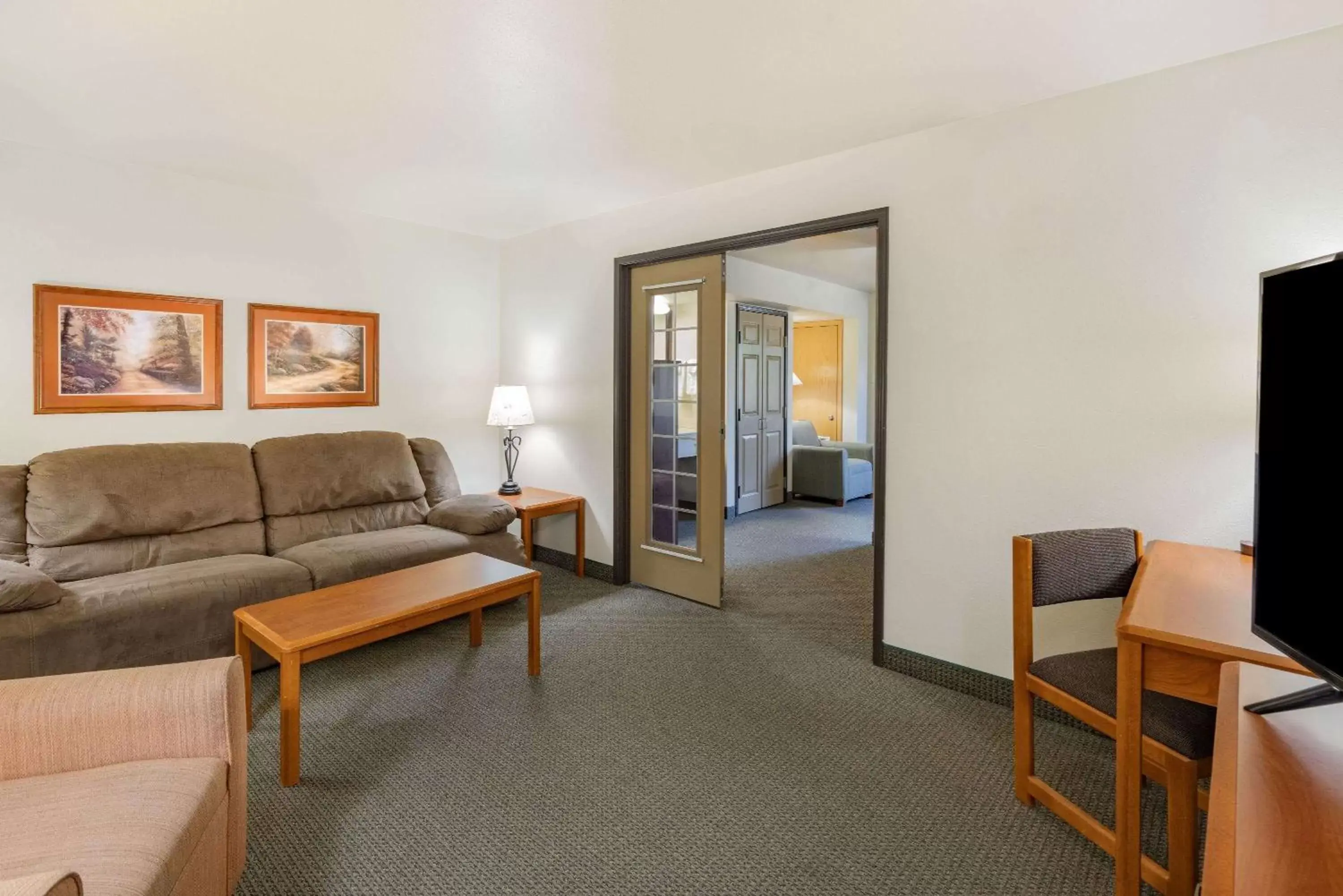 Photo of the whole room, Seating Area in AmericInn by Wyndham Havre