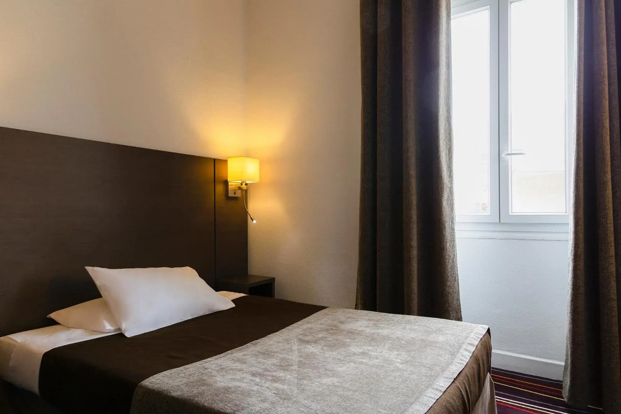 Bed in Inter Hotel Astoria-Vatican