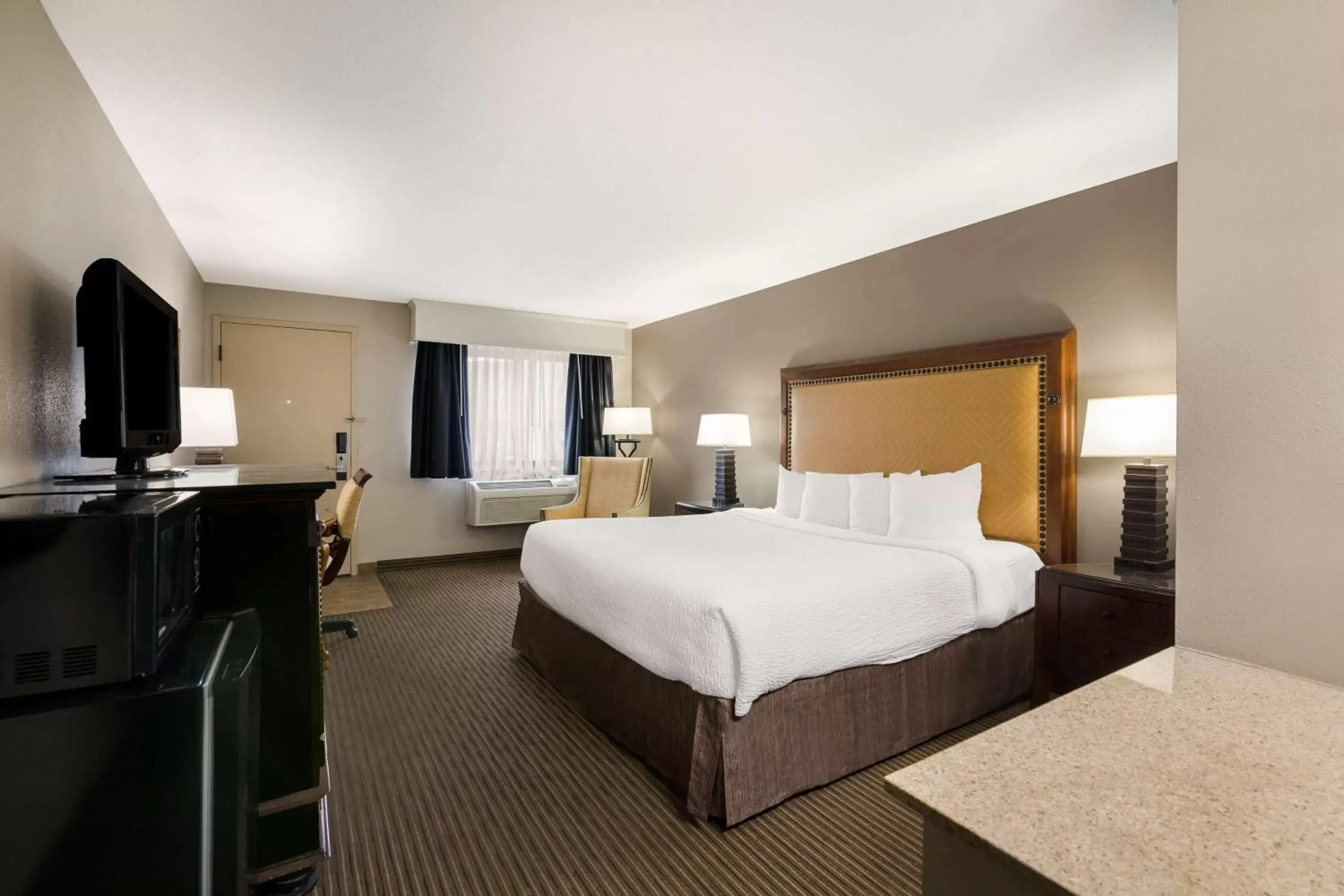 Bedroom, Bed in Revel Hotel Minot - SureStay Collection by Best Western