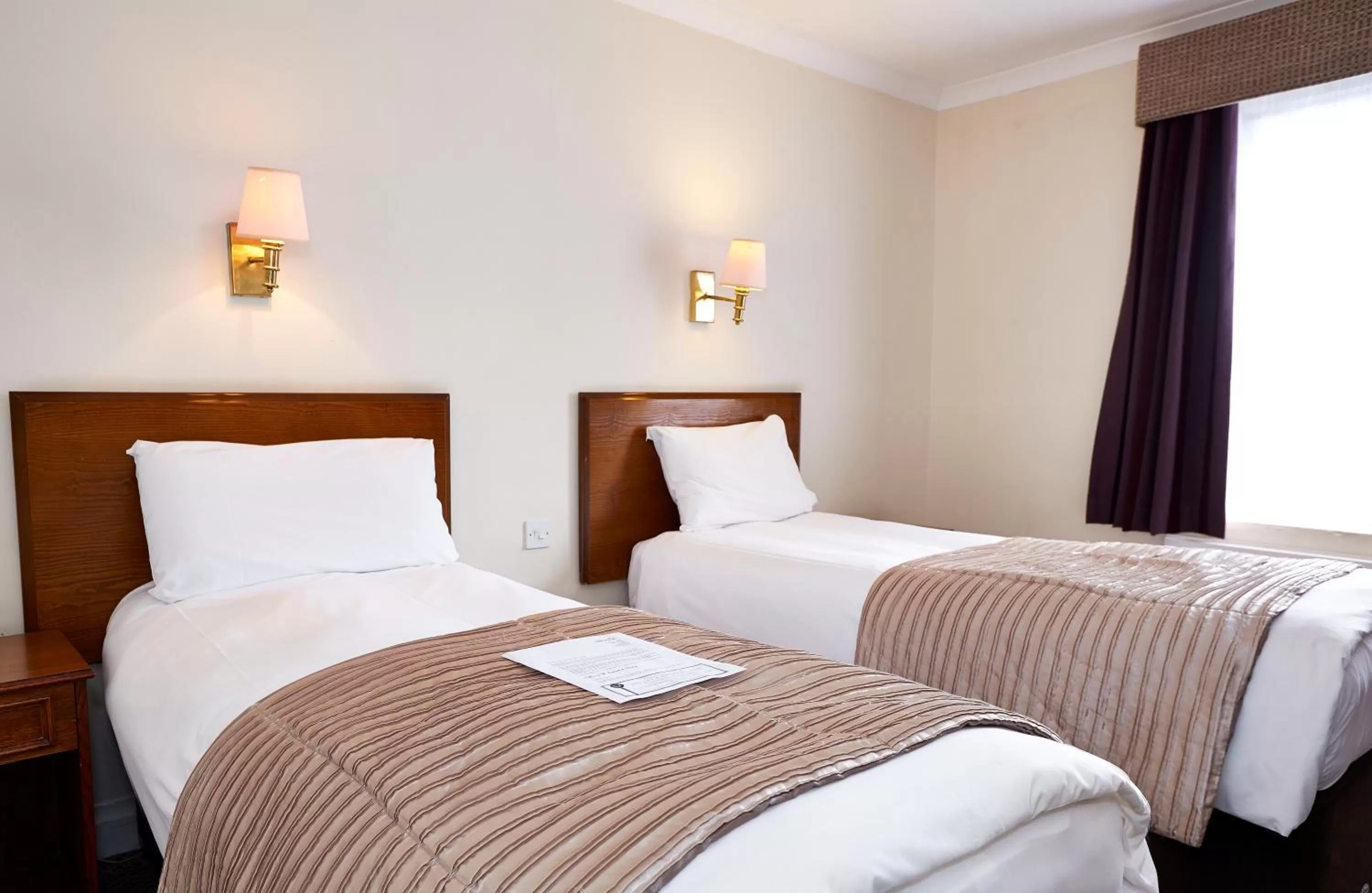 Bed in Raven Hotel by Greene King Inns