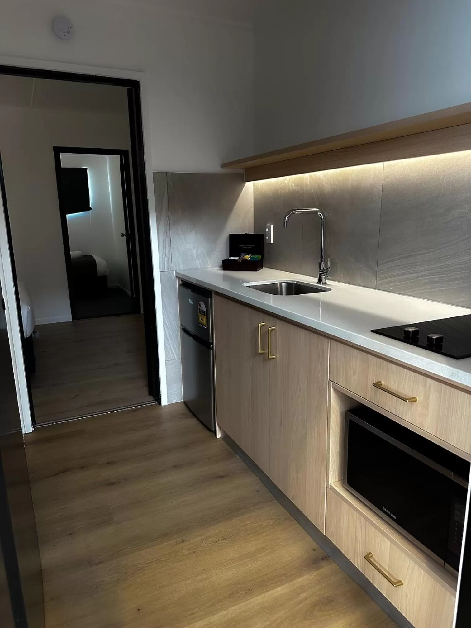 Kitchen or kitchenette in Burwood Motel