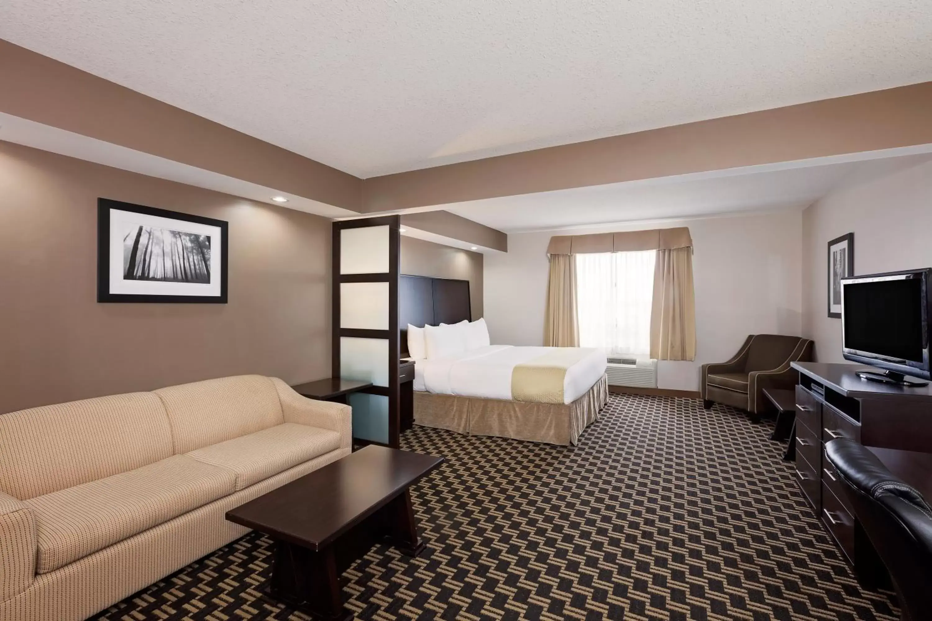 Bedroom, Seating Area in Ramada by Wyndham Cold Lake