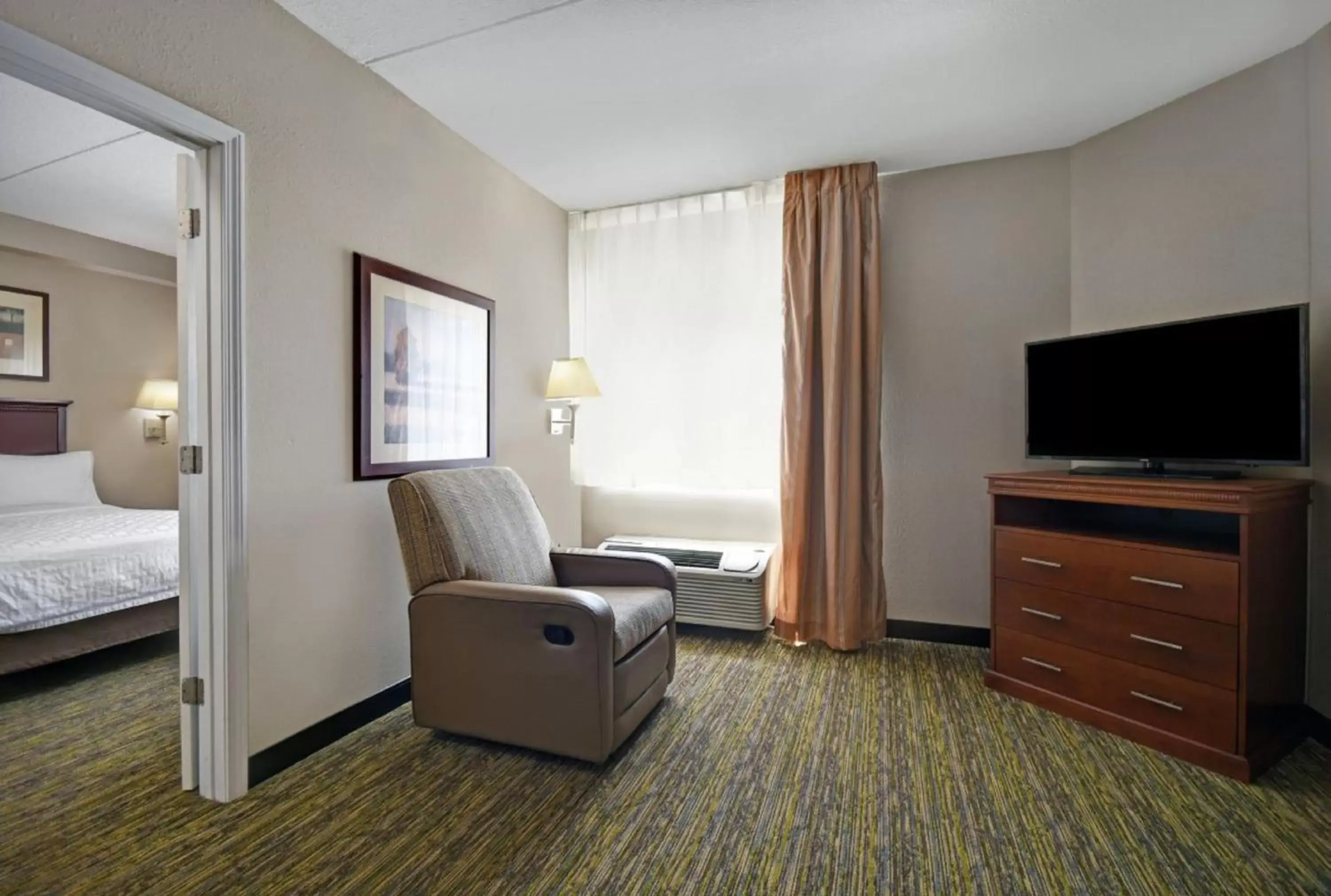 Photo of the whole room, Seating Area in Candlewood Suites - Mooresville Lake Norman, an IHG Hotel