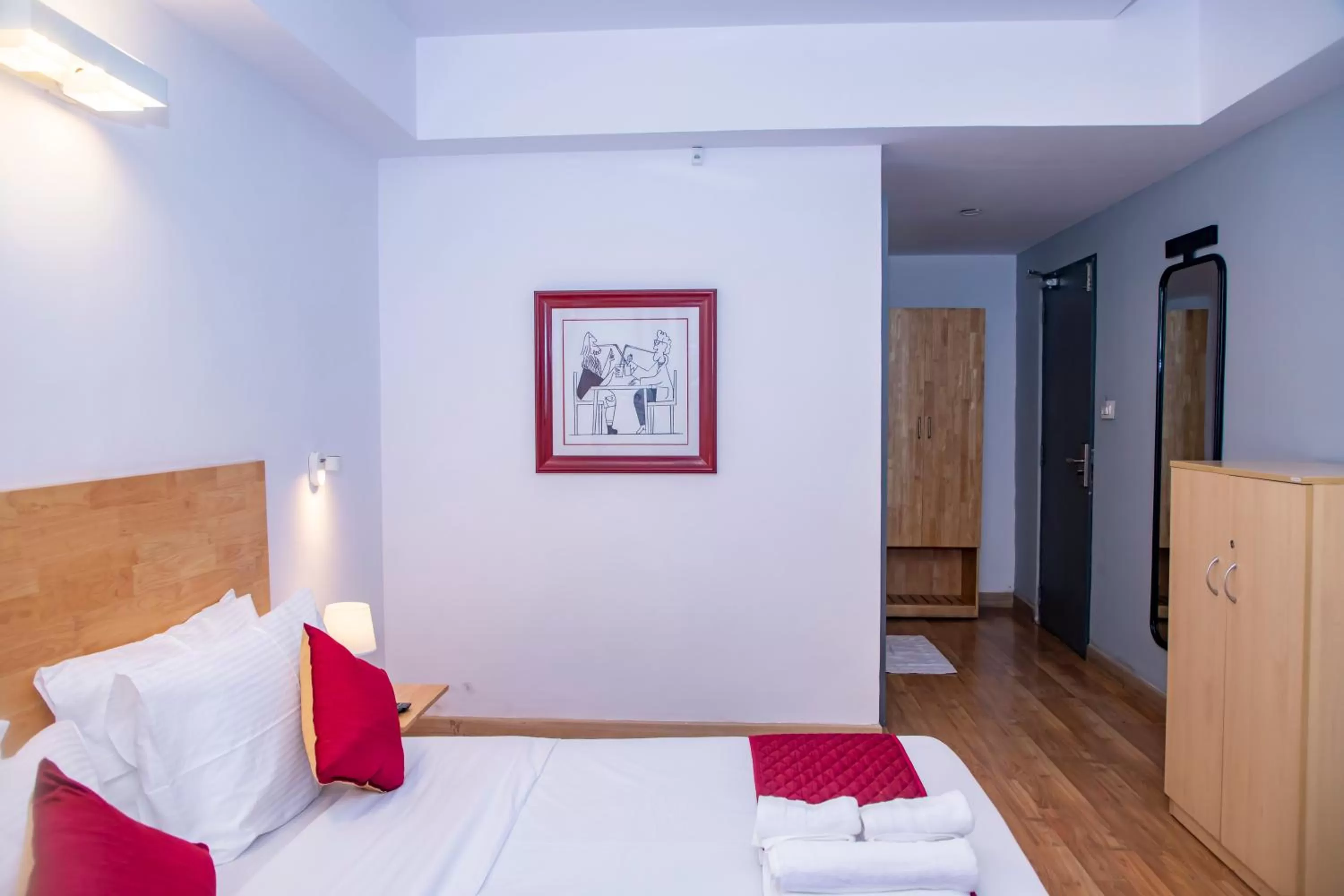 Photo of the whole room, Bed in The Urban Stays