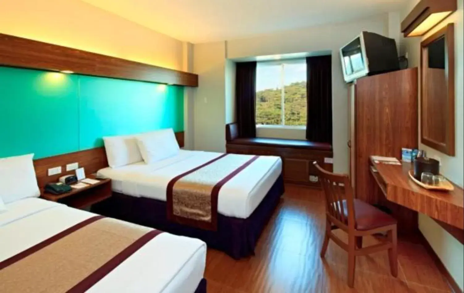 Bed in Microtel by Wyndham Baguio