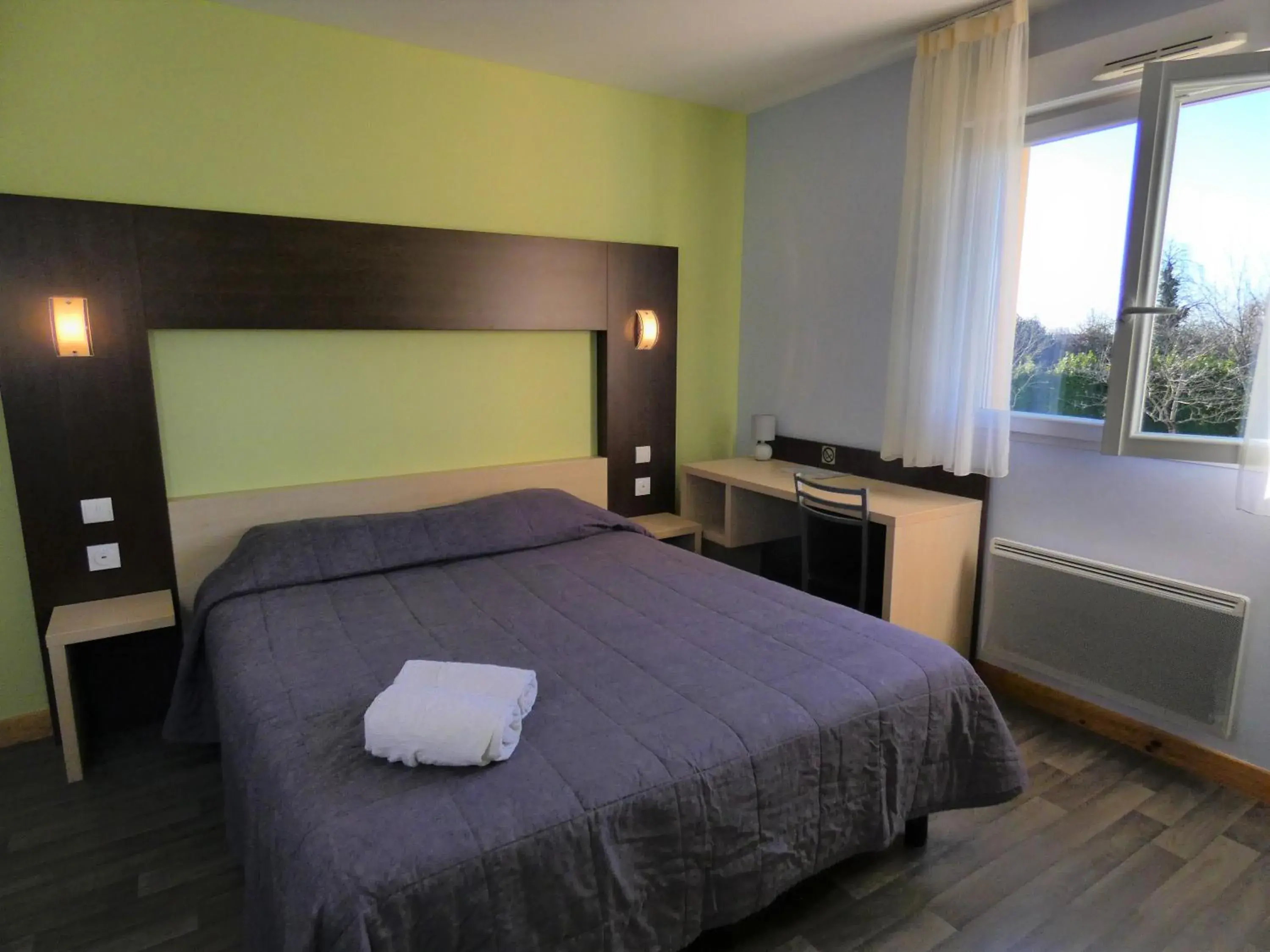 air conditioner, Bed in Hôtel Azur Saint Junien Cit'Hotel