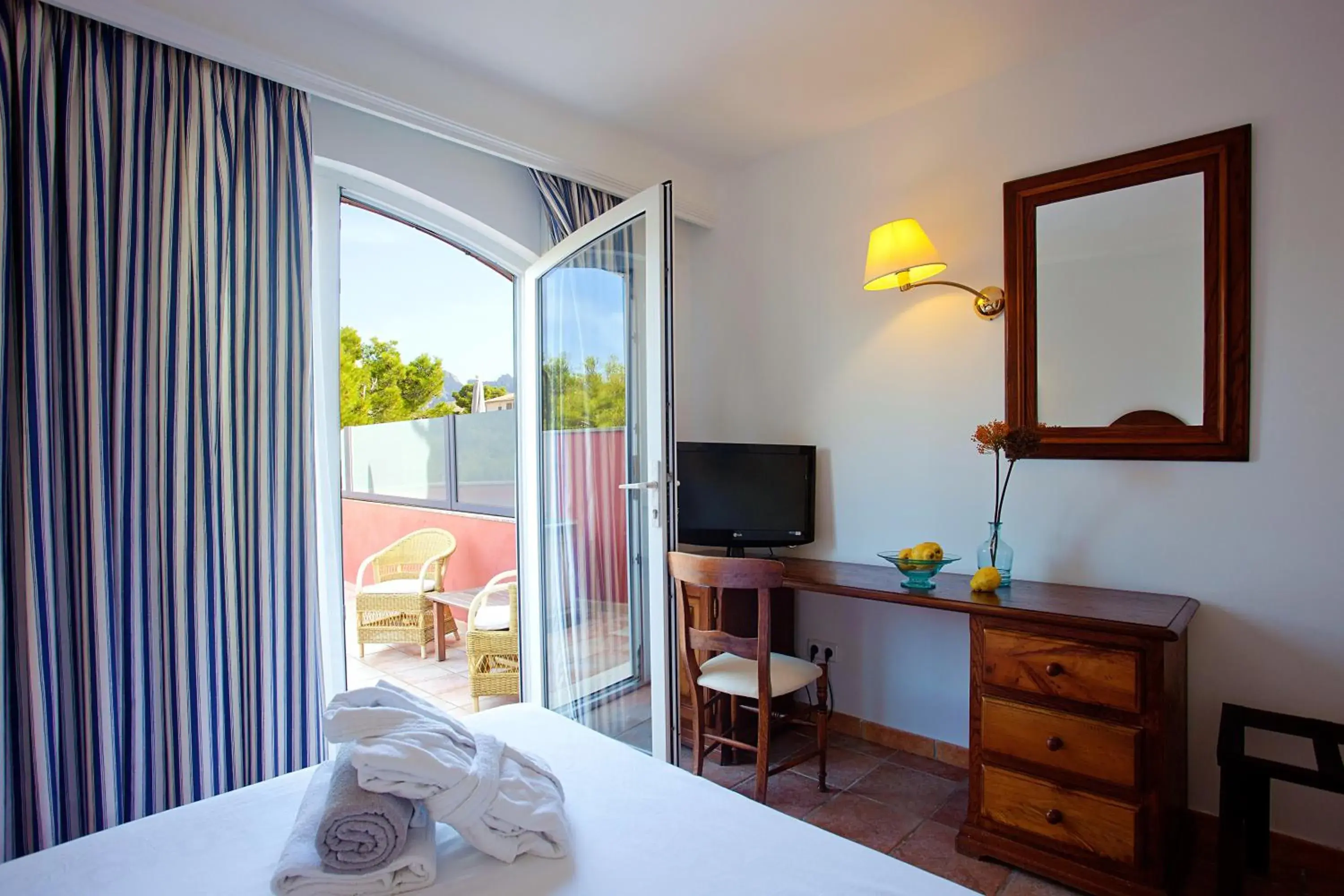 Photo of the whole room, Bed in Hotel Cala Sant Vicenc - Adults Only